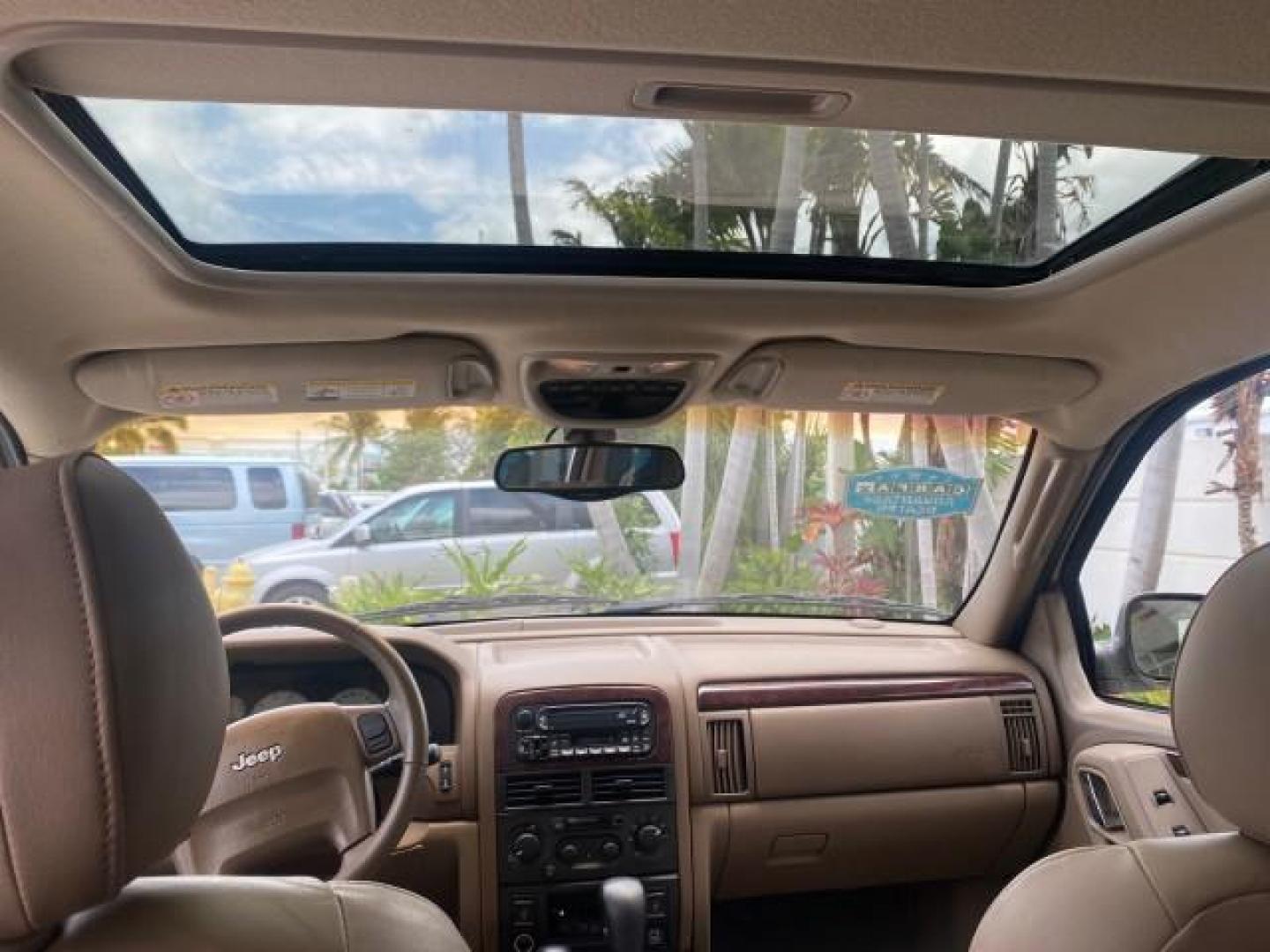 2004 Stone White /Sandstone Jeep Grand Cherokee Limited 4WD SUNROOF (1J8GW58N14C) with an 4.7L 8-Cyl Engine engine, Automatic transmission, located at 4701 North Dixie Hwy, Pompano Beach, FL, 33064, (954) 422-2889, 26.240938, -80.123474 - OUR WEBPAGE FLORIDACARS1.COM HAS OVER 100 PHOTOS AND FREE CARFAX LINK 2004 JEEP GRAND CHEROKEE LIMITED A TRUE CLASSIC WONT LAST IN STOCK VIN: 1J8GW58N14C199129 1 J 8 G W 5 8 N 1 4 C 1 9 9 1 2 9 4 DOOR WAGON/SPORT UTILITY 4.7L V8 F SOHC TOW PKG AND FRONT TOW HITCH WITH PLUG GASOLINE REAR WHEEL DRIVE - Photo#65