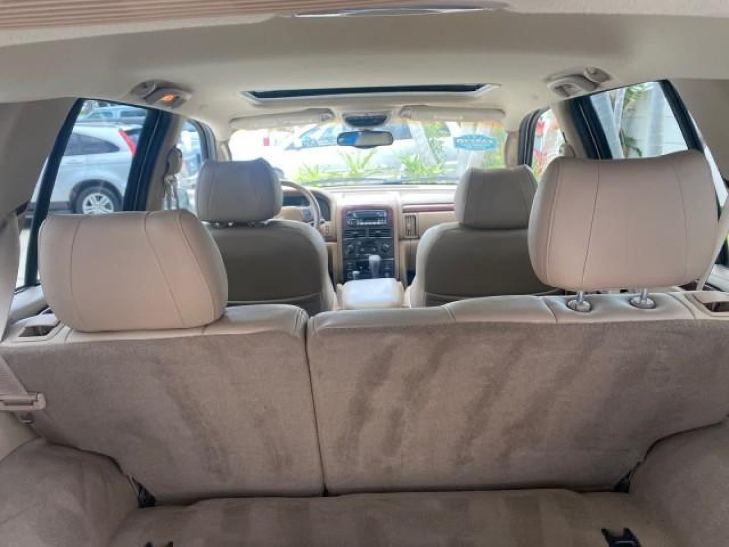 2004 Stone White /Sandstone Jeep Grand Cherokee Limited 4WD SUNROOF (1J8GW58N14C) with an 4.7L 8-Cyl Engine engine, Automatic transmission, located at 4701 North Dixie Hwy, Pompano Beach, FL, 33064, (954) 422-2889, 26.240938, -80.123474 - OUR WEBPAGE FLORIDACARS1.COM HAS OVER 100 PHOTOS AND FREE CARFAX LINK 2004 JEEP GRAND CHEROKEE LIMITED A TRUE CLASSIC WONT LAST IN STOCK VIN: 1J8GW58N14C199129 1 J 8 G W 5 8 N 1 4 C 1 9 9 1 2 9 4 DOOR WAGON/SPORT UTILITY 4.7L V8 F SOHC TOW PKG AND FRONT TOW HITCH WITH PLUG GASOLINE REAR WHEEL DRIVE - Photo#80