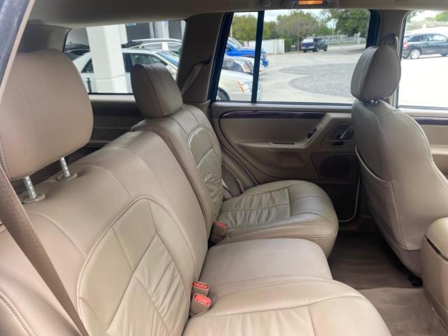 2004 Stone White /Sandstone Jeep Grand Cherokee Limited 4WD SUNROOF (1J8GW58N14C) with an 4.7L 8-Cyl Engine engine, Automatic transmission, located at 4701 North Dixie Hwy, Pompano Beach, FL, 33064, (954) 422-2889, 26.240938, -80.123474 - OUR WEBPAGE FLORIDACARS1.COM HAS OVER 100 PHOTOS AND FREE CARFAX LINK 2004 JEEP GRAND CHEROKEE LIMITED A TRUE CLASSIC WONT LAST IN STOCK VIN: 1J8GW58N14C199129 1 J 8 G W 5 8 N 1 4 C 1 9 9 1 2 9 4 DOOR WAGON/SPORT UTILITY 4.7L V8 F SOHC TOW PKG AND FRONT TOW HITCH WITH PLUG GASOLINE REAR WHEEL DRIVE - Photo#87