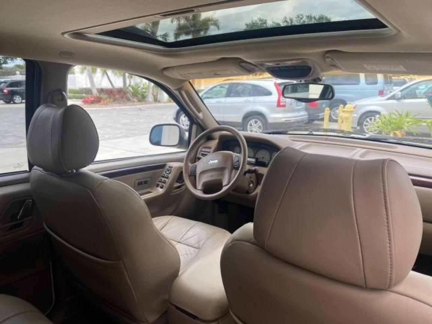 2004 Stone White /Sandstone Jeep Grand Cherokee Limited 4WD SUNROOF (1J8GW58N14C) with an 4.7L 8-Cyl Engine engine, Automatic transmission, located at 4701 North Dixie Hwy, Pompano Beach, FL, 33064, (954) 422-2889, 26.240938, -80.123474 - OUR WEBPAGE FLORIDACARS1.COM HAS OVER 100 PHOTOS AND FREE CARFAX LINK 2004 JEEP GRAND CHEROKEE LIMITED A TRUE CLASSIC WONT LAST IN STOCK VIN: 1J8GW58N14C199129 1 J 8 G W 5 8 N 1 4 C 1 9 9 1 2 9 4 DOOR WAGON/SPORT UTILITY 4.7L V8 F SOHC TOW PKG AND FRONT TOW HITCH WITH PLUG GASOLINE REAR WHEEL DRIVE - Photo#88