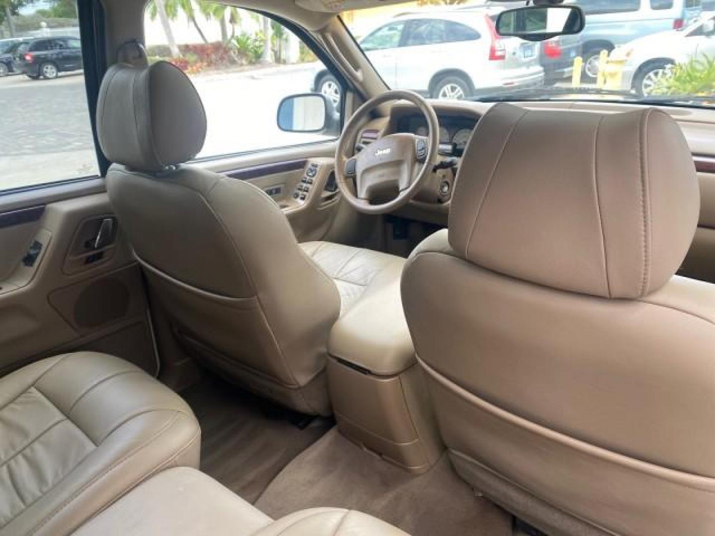 2004 Stone White /Sandstone Jeep Grand Cherokee Limited 4WD SUNROOF (1J8GW58N14C) with an 4.7L 8-Cyl Engine engine, Automatic transmission, located at 4701 North Dixie Hwy, Pompano Beach, FL, 33064, (954) 422-2889, 26.240938, -80.123474 - OUR WEBPAGE FLORIDACARS1.COM HAS OVER 100 PHOTOS AND FREE CARFAX LINK 2004 JEEP GRAND CHEROKEE LIMITED A TRUE CLASSIC WONT LAST IN STOCK VIN: 1J8GW58N14C199129 1 J 8 G W 5 8 N 1 4 C 1 9 9 1 2 9 4 DOOR WAGON/SPORT UTILITY 4.7L V8 F SOHC TOW PKG AND FRONT TOW HITCH WITH PLUG GASOLINE REAR WHEEL DRIVE - Photo#89
