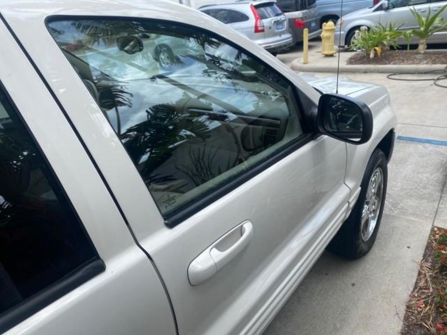 2004 Stone White /Sandstone Jeep Grand Cherokee Limited 4WD SUNROOF (1J8GW58N14C) with an 4.7L 8-Cyl Engine engine, Automatic transmission, located at 4701 North Dixie Hwy, Pompano Beach, FL, 33064, (954) 422-2889, 26.240938, -80.123474 - OUR WEBPAGE FLORIDACARS1.COM HAS OVER 100 PHOTOS AND FREE CARFAX LINK 2004 JEEP GRAND CHEROKEE LIMITED A TRUE CLASSIC WONT LAST IN STOCK VIN: 1J8GW58N14C199129 1 J 8 G W 5 8 N 1 4 C 1 9 9 1 2 9 4 DOOR WAGON/SPORT UTILITY 4.7L V8 F SOHC TOW PKG AND FRONT TOW HITCH WITH PLUG GASOLINE REAR WHEEL DRIVE - Photo#90