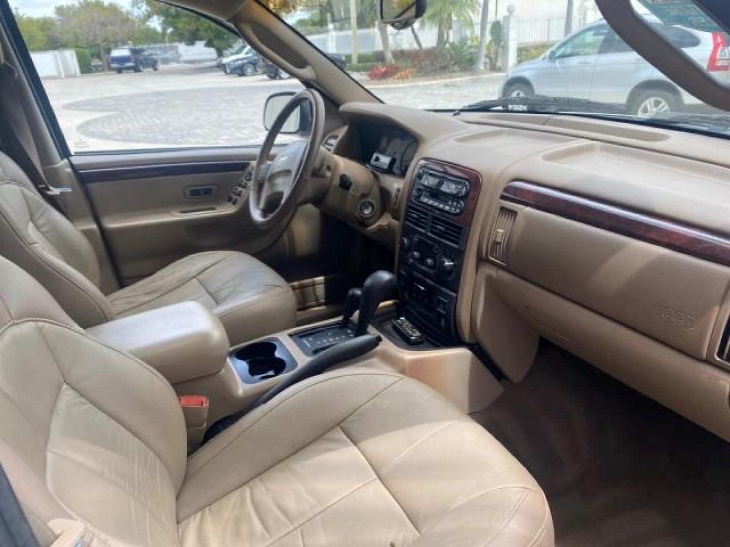 2004 Stone White /Sandstone Jeep Grand Cherokee Limited 4WD SUNROOF (1J8GW58N14C) with an 4.7L 8-Cyl Engine engine, Automatic transmission, located at 4701 North Dixie Hwy, Pompano Beach, FL, 33064, (954) 422-2889, 26.240938, -80.123474 - OUR WEBPAGE FLORIDACARS1.COM HAS OVER 100 PHOTOS AND FREE CARFAX LINK 2004 JEEP GRAND CHEROKEE LIMITED A TRUE CLASSIC WONT LAST IN STOCK VIN: 1J8GW58N14C199129 1 J 8 G W 5 8 N 1 4 C 1 9 9 1 2 9 4 DOOR WAGON/SPORT UTILITY 4.7L V8 F SOHC TOW PKG AND FRONT TOW HITCH WITH PLUG GASOLINE REAR WHEEL DRIVE - Photo#93