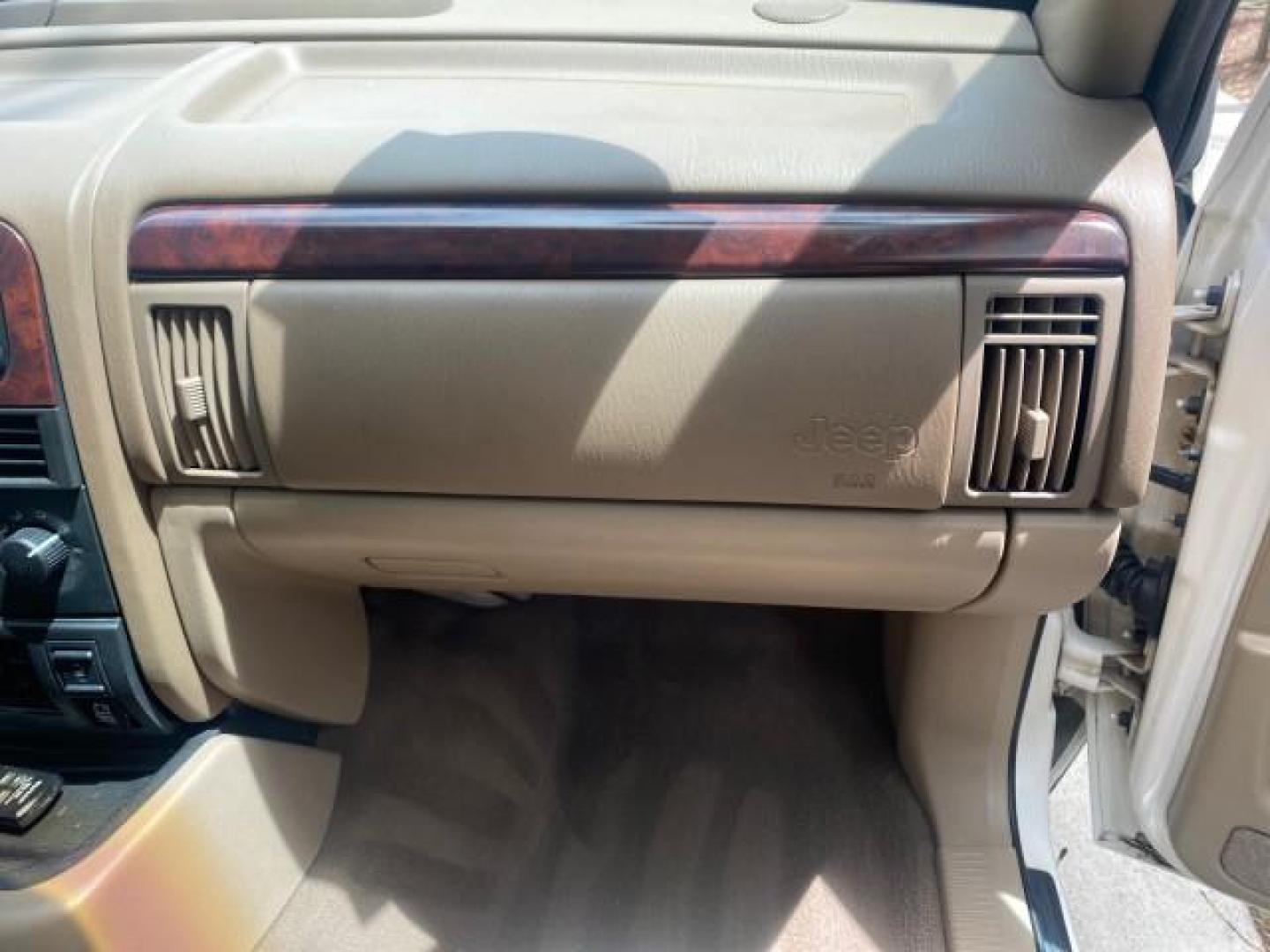 2004 Stone White /Sandstone Jeep Grand Cherokee Limited 4WD SUNROOF (1J8GW58N14C) with an 4.7L 8-Cyl Engine engine, Automatic transmission, located at 4701 North Dixie Hwy, Pompano Beach, FL, 33064, (954) 422-2889, 26.240938, -80.123474 - OUR WEBPAGE FLORIDACARS1.COM HAS OVER 100 PHOTOS AND FREE CARFAX LINK 2004 JEEP GRAND CHEROKEE LIMITED A TRUE CLASSIC WONT LAST IN STOCK VIN: 1J8GW58N14C199129 1 J 8 G W 5 8 N 1 4 C 1 9 9 1 2 9 4 DOOR WAGON/SPORT UTILITY 4.7L V8 F SOHC TOW PKG AND FRONT TOW HITCH WITH PLUG GASOLINE REAR WHEEL DRIVE - Photo#97