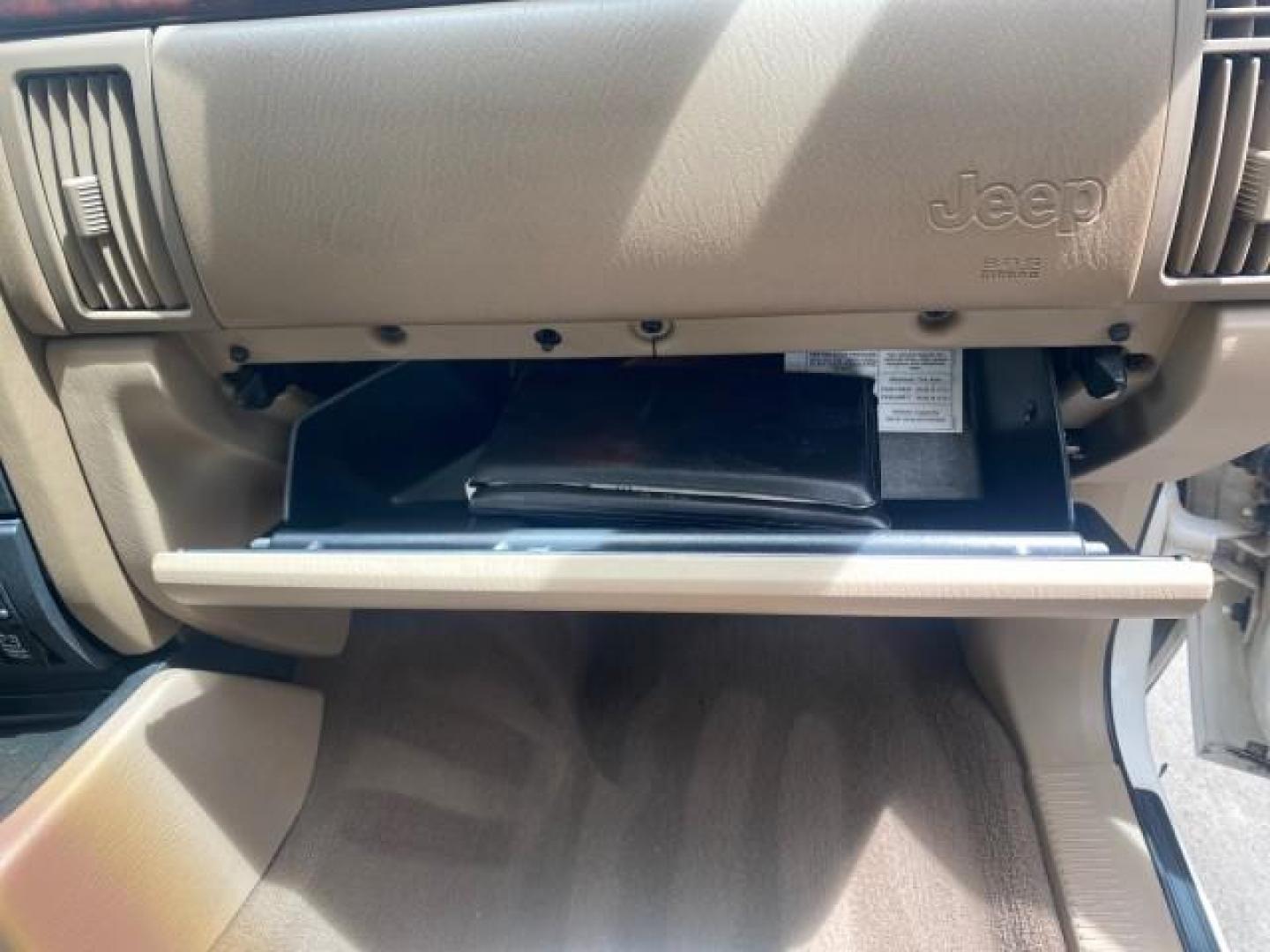 2004 Stone White /Sandstone Jeep Grand Cherokee Limited 4WD SUNROOF (1J8GW58N14C) with an 4.7L 8-Cyl Engine engine, Automatic transmission, located at 4701 North Dixie Hwy, Pompano Beach, FL, 33064, (954) 422-2889, 26.240938, -80.123474 - OUR WEBPAGE FLORIDACARS1.COM HAS OVER 100 PHOTOS AND FREE CARFAX LINK 2004 JEEP GRAND CHEROKEE LIMITED A TRUE CLASSIC WONT LAST IN STOCK VIN: 1J8GW58N14C199129 1 J 8 G W 5 8 N 1 4 C 1 9 9 1 2 9 4 DOOR WAGON/SPORT UTILITY 4.7L V8 F SOHC TOW PKG AND FRONT TOW HITCH WITH PLUG GASOLINE REAR WHEEL DRIVE - Photo#98