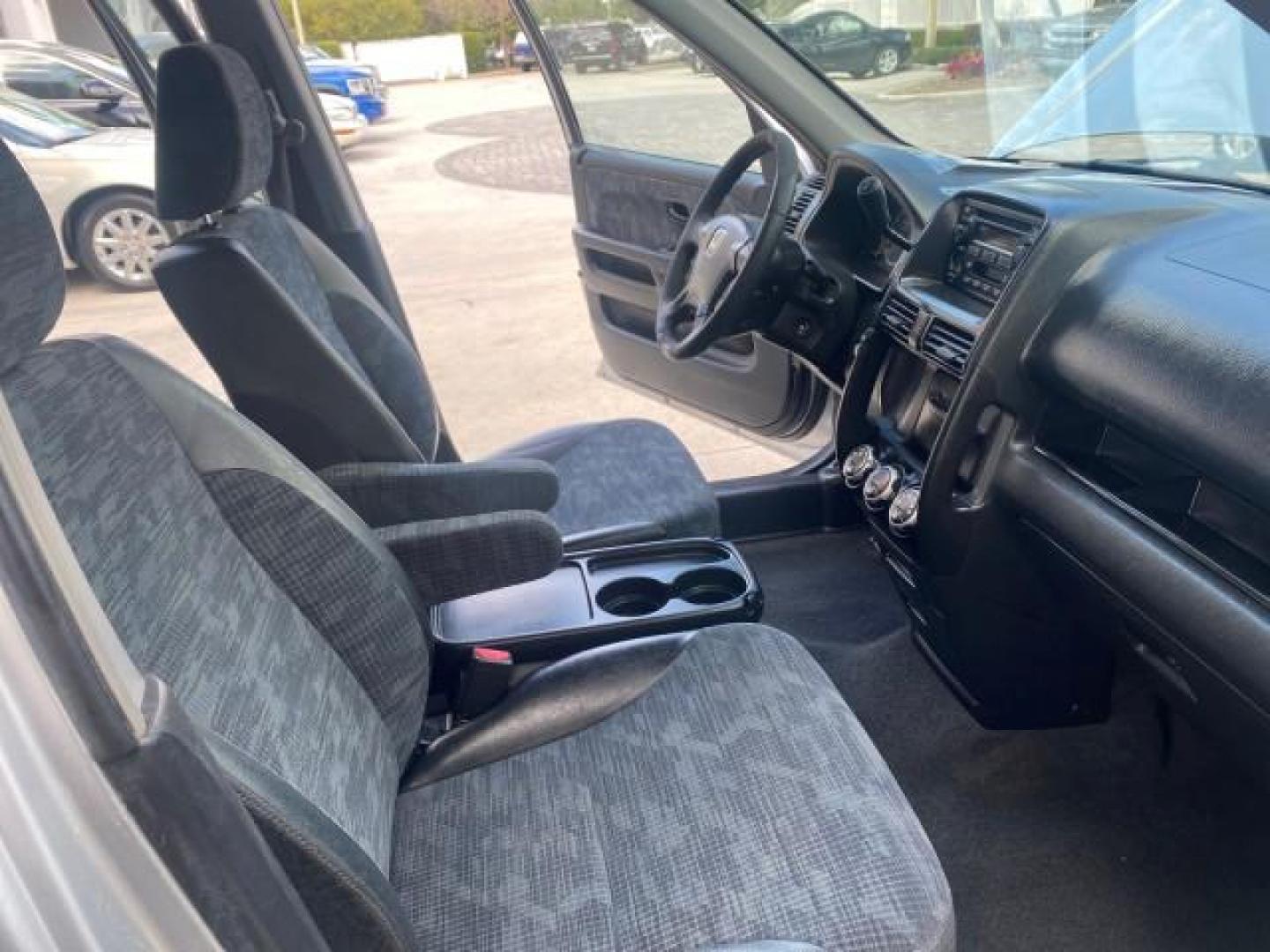 2004 Satin Silver Metallic /Black Honda CR-V LX FLORIDA 22 SERVICES (SHSRD68494U) with an 2.4L DOHC PGM-FI 16-Valve i-VTEC I4 Engine engine, Automatic transmission, located at 4701 North Dixie Hwy, Pompano Beach, FL, 33064, (954) 422-2889, 26.240938, -80.123474 - OUR WEBPAGE FLORIDACARS1.COM HAS OVER 100 PHOTOS AND FREE CARFAX LINK 2004 HONDA CR-V LX VIN: SHSRD68494U204432 S H S R D 6 8 4 9 4 U 2 0 4 4 3 2 4 DOOR WAGON/SPORT UTILITY 2.4L I4 F SOHC GASOLINE 29 MPG FRONT WHEEL DRIVE Top Features Leatherette and Cloth Basic Features AM/FM Stereo CD Audio Powe - Photo#12