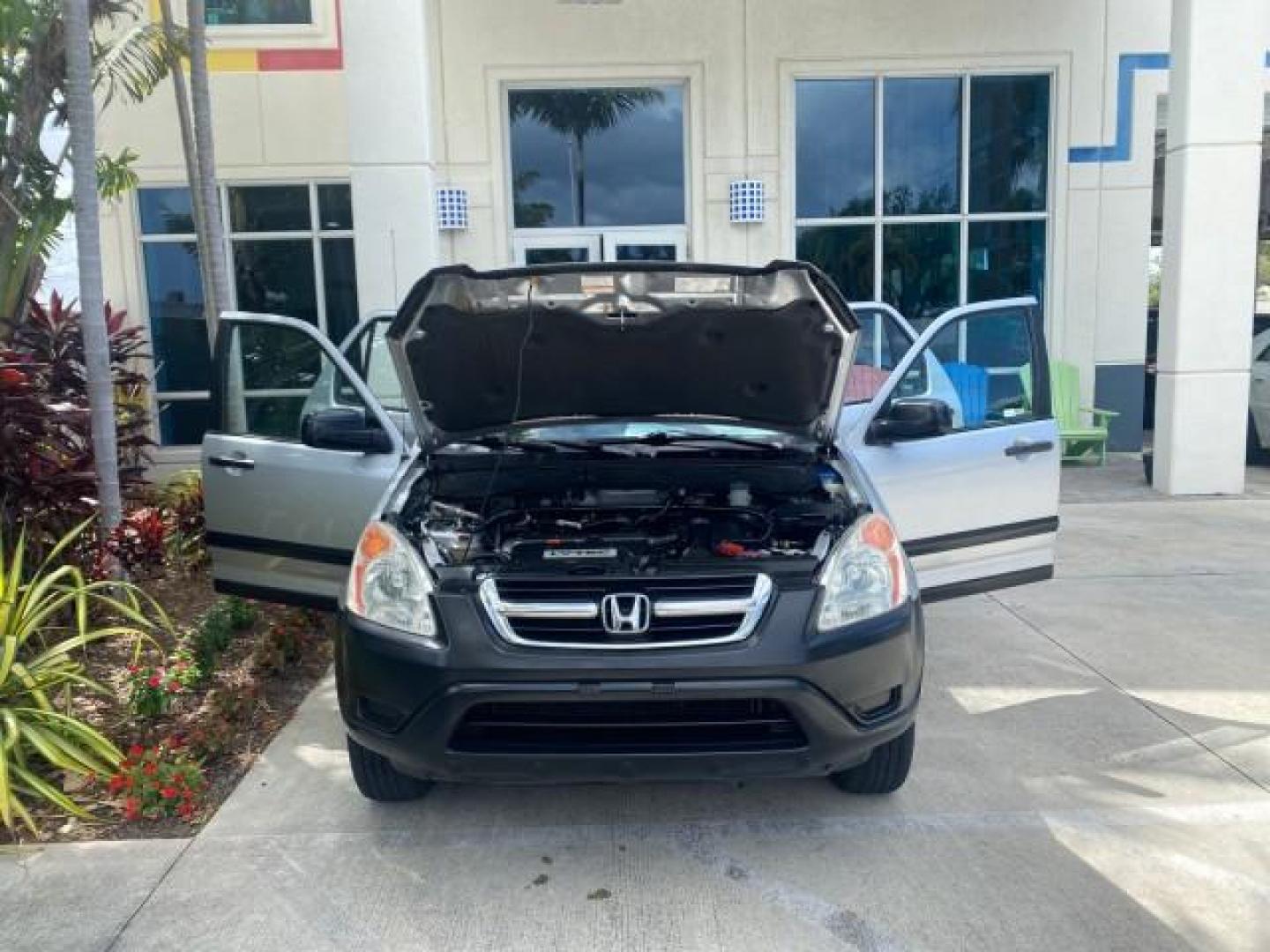 2004 Satin Silver Metallic /Black Honda CR-V LX FLORIDA 22 SERVICES (SHSRD68494U) with an 2.4L DOHC PGM-FI 16-Valve i-VTEC I4 Engine engine, Automatic transmission, located at 4701 North Dixie Hwy, Pompano Beach, FL, 33064, (954) 422-2889, 26.240938, -80.123474 - OUR WEBPAGE FLORIDACARS1.COM HAS OVER 100 PHOTOS AND FREE CARFAX LINK 2004 HONDA CR-V LX VIN: SHSRD68494U204432 S H S R D 6 8 4 9 4 U 2 0 4 4 3 2 4 DOOR WAGON/SPORT UTILITY 2.4L I4 F SOHC GASOLINE 29 MPG FRONT WHEEL DRIVE Top Features Leatherette and Cloth Basic Features AM/FM Stereo CD Audio Powe - Photo#16