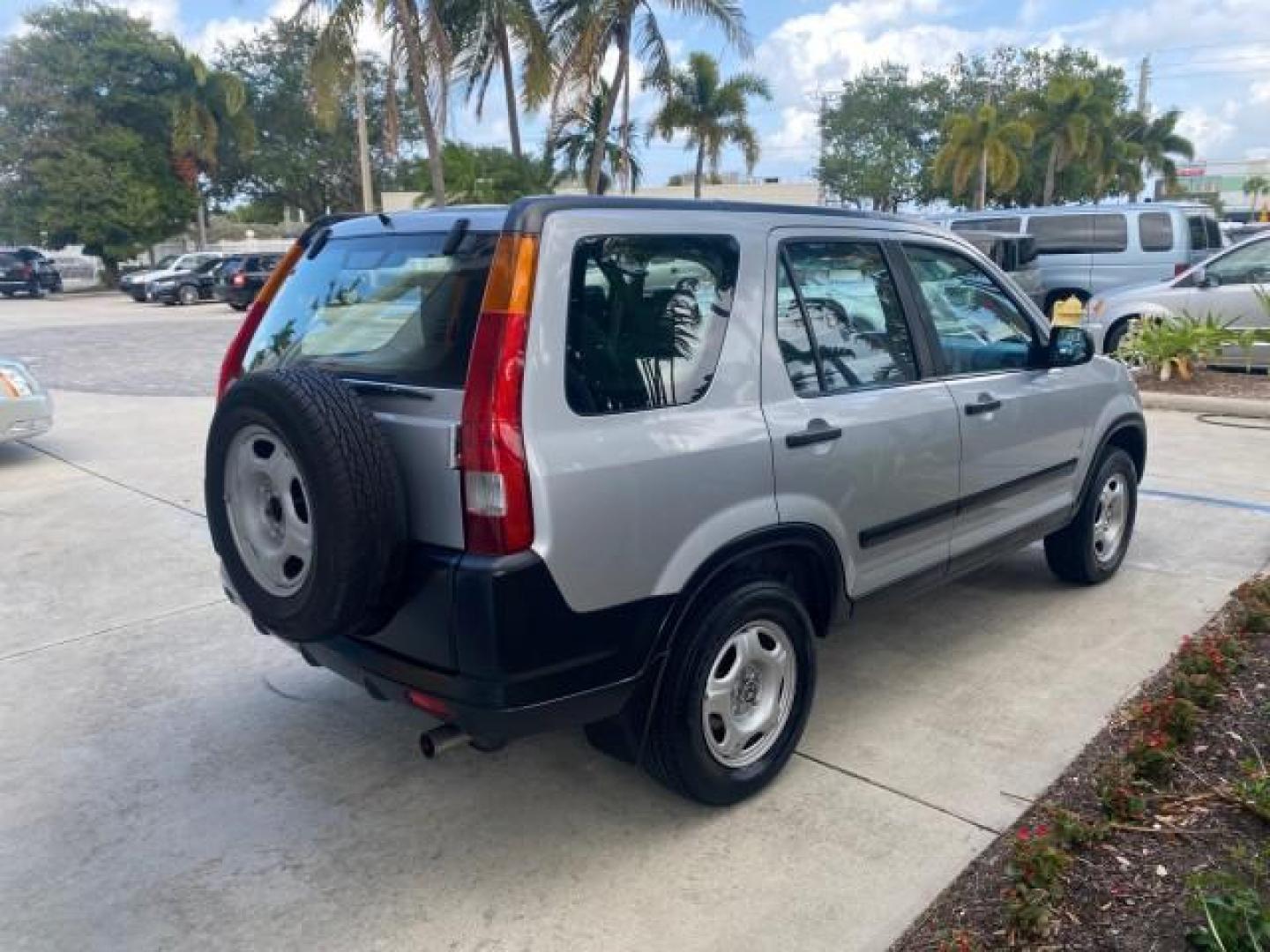 2004 Satin Silver Metallic /Black Honda CR-V LX FLORIDA 22 SERVICES (SHSRD68494U) with an 2.4L DOHC PGM-FI 16-Valve i-VTEC I4 Engine engine, Automatic transmission, located at 4701 North Dixie Hwy, Pompano Beach, FL, 33064, (954) 422-2889, 26.240938, -80.123474 - OUR WEBPAGE FLORIDACARS1.COM HAS OVER 100 PHOTOS AND FREE CARFAX LINK 2004 HONDA CR-V LX VIN: SHSRD68494U204432 S H S R D 6 8 4 9 4 U 2 0 4 4 3 2 4 DOOR WAGON/SPORT UTILITY 2.4L I4 F SOHC GASOLINE 29 MPG FRONT WHEEL DRIVE Top Features Leatherette and Cloth Basic Features AM/FM Stereo CD Audio Powe - Photo#7