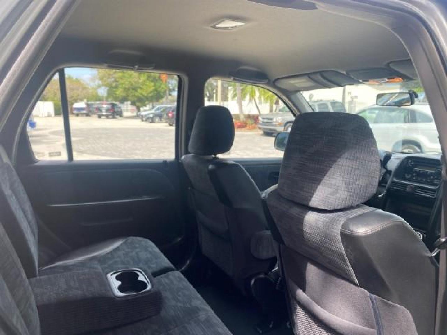 2004 Satin Silver Metallic /Black Honda CR-V LX FLORIDA 22 SERVICES (SHSRD68494U) with an 2.4L DOHC PGM-FI 16-Valve i-VTEC I4 Engine engine, Automatic transmission, located at 4701 North Dixie Hwy, Pompano Beach, FL, 33064, (954) 422-2889, 26.240938, -80.123474 - OUR WEBPAGE FLORIDACARS1.COM HAS OVER 100 PHOTOS AND FREE CARFAX LINK 2004 HONDA CR-V LX VIN: SHSRD68494U204432 S H S R D 6 8 4 9 4 U 2 0 4 4 3 2 4 DOOR WAGON/SPORT UTILITY 2.4L I4 F SOHC GASOLINE 29 MPG FRONT WHEEL DRIVE Top Features Leatherette and Cloth Basic Features AM/FM Stereo CD Audio Powe - Photo#79