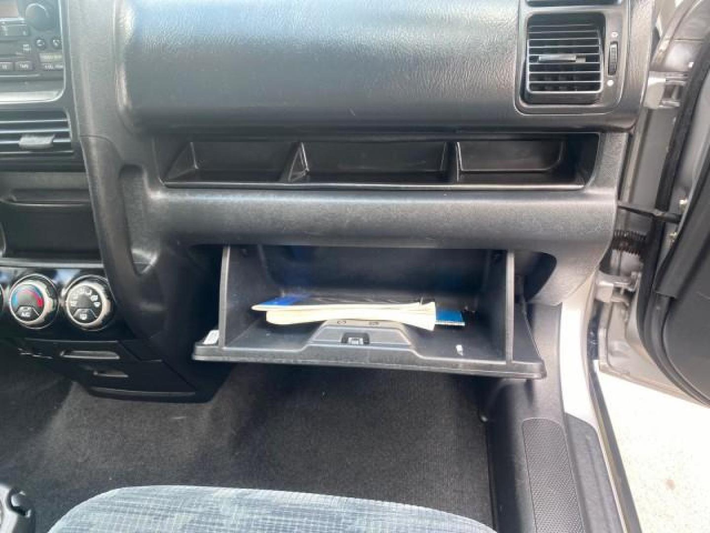 2004 Satin Silver Metallic /Black Honda CR-V LX FLORIDA 22 SERVICES (SHSRD68494U) with an 2.4L DOHC PGM-FI 16-Valve i-VTEC I4 Engine engine, Automatic transmission, located at 4701 North Dixie Hwy, Pompano Beach, FL, 33064, (954) 422-2889, 26.240938, -80.123474 - OUR WEBPAGE FLORIDACARS1.COM HAS OVER 100 PHOTOS AND FREE CARFAX LINK 2004 HONDA CR-V LX VIN: SHSRD68494U204432 S H S R D 6 8 4 9 4 U 2 0 4 4 3 2 4 DOOR WAGON/SPORT UTILITY 2.4L I4 F SOHC GASOLINE 29 MPG FRONT WHEEL DRIVE Top Features Leatherette and Cloth Basic Features AM/FM Stereo CD Audio Powe - Photo#92