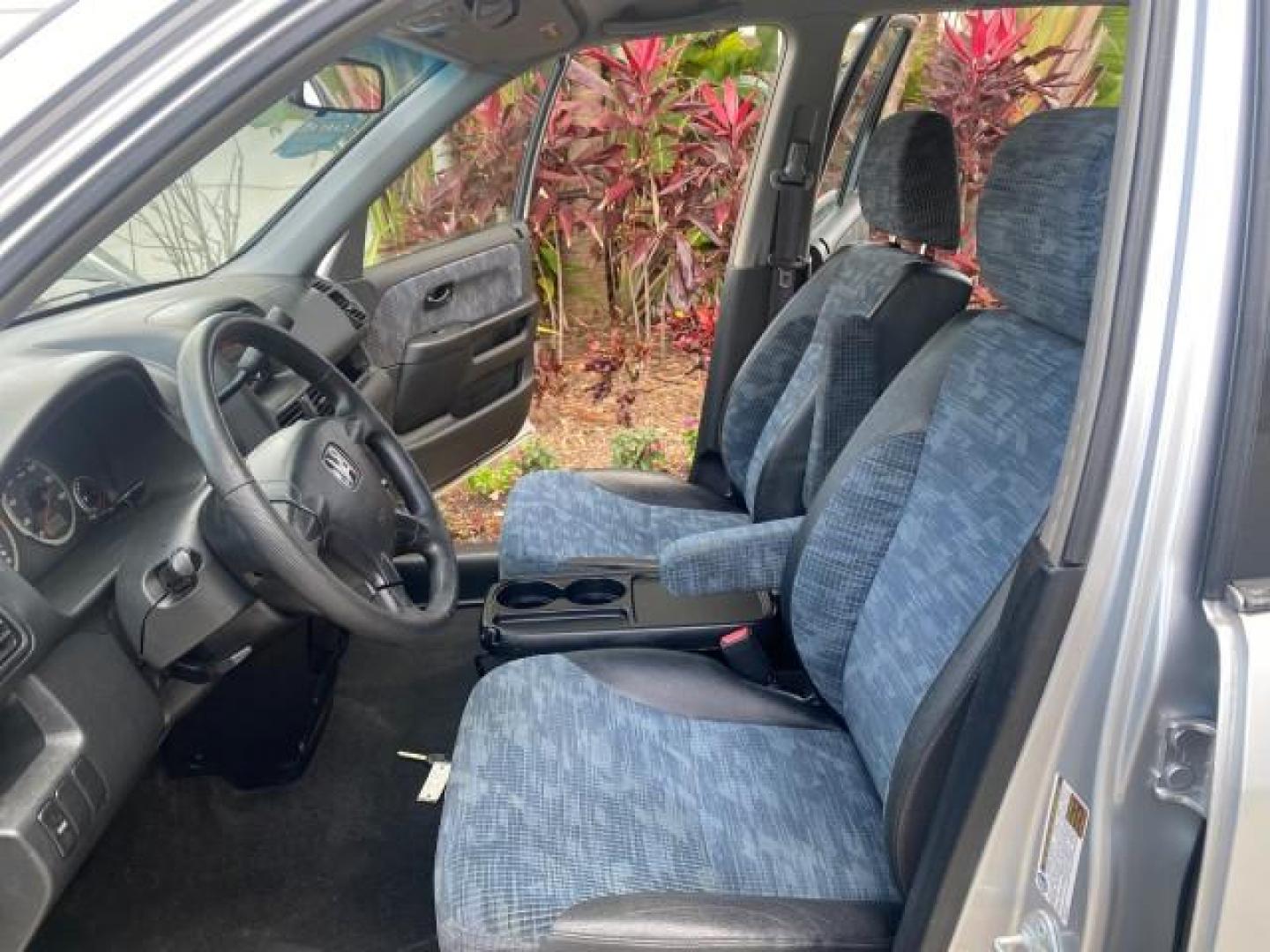 2004 Satin Silver Metallic /Black Honda CR-V LX LOW MILES 44,323 (SHSRD684X4U) with an 2.4L DOHC PGM-FI 16-Valve i-VTEC I4 Engine engine, Automatic transmission, located at 4701 North Dixie Hwy, Pompano Beach, FL, 33064, (954) 422-2889, 26.240938, -80.123474 - OUR WEBPAGE FLORIDACARS1.COM HAS OVER 100 PHOTOS AND FREE CARFAX LINK 2004 HONDA CR-V LX VIN: SHSRD684X4U202379 S H S R D 6 8 4 X 4 U 2 0 2 3 7 9 4 DOOR WAGON/SPORT UTILITY 2.4L I4 F SOHC GASOLINE 29 MPG FRONT WHEEL DRIVE Top Features Leatherette and Cloth Basic Features AM/FM Stereo CD Audio Powe - Photo#10