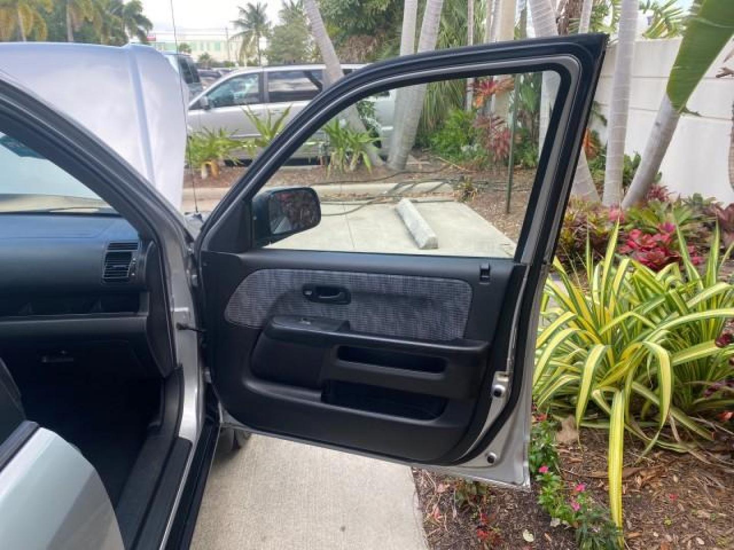 2004 Satin Silver Metallic /Black Honda CR-V LX LOW MILES 44,323 (SHSRD684X4U) with an 2.4L DOHC PGM-FI 16-Valve i-VTEC I4 Engine engine, Automatic transmission, located at 4701 North Dixie Hwy, Pompano Beach, FL, 33064, (954) 422-2889, 26.240938, -80.123474 - OUR WEBPAGE FLORIDACARS1.COM HAS OVER 100 PHOTOS AND FREE CARFAX LINK 2004 HONDA CR-V LX VIN: SHSRD684X4U202379 S H S R D 6 8 4 X 4 U 2 0 2 3 7 9 4 DOOR WAGON/SPORT UTILITY 2.4L I4 F SOHC GASOLINE 29 MPG FRONT WHEEL DRIVE Top Features Leatherette and Cloth Basic Features AM/FM Stereo CD Audio Powe - Photo#11