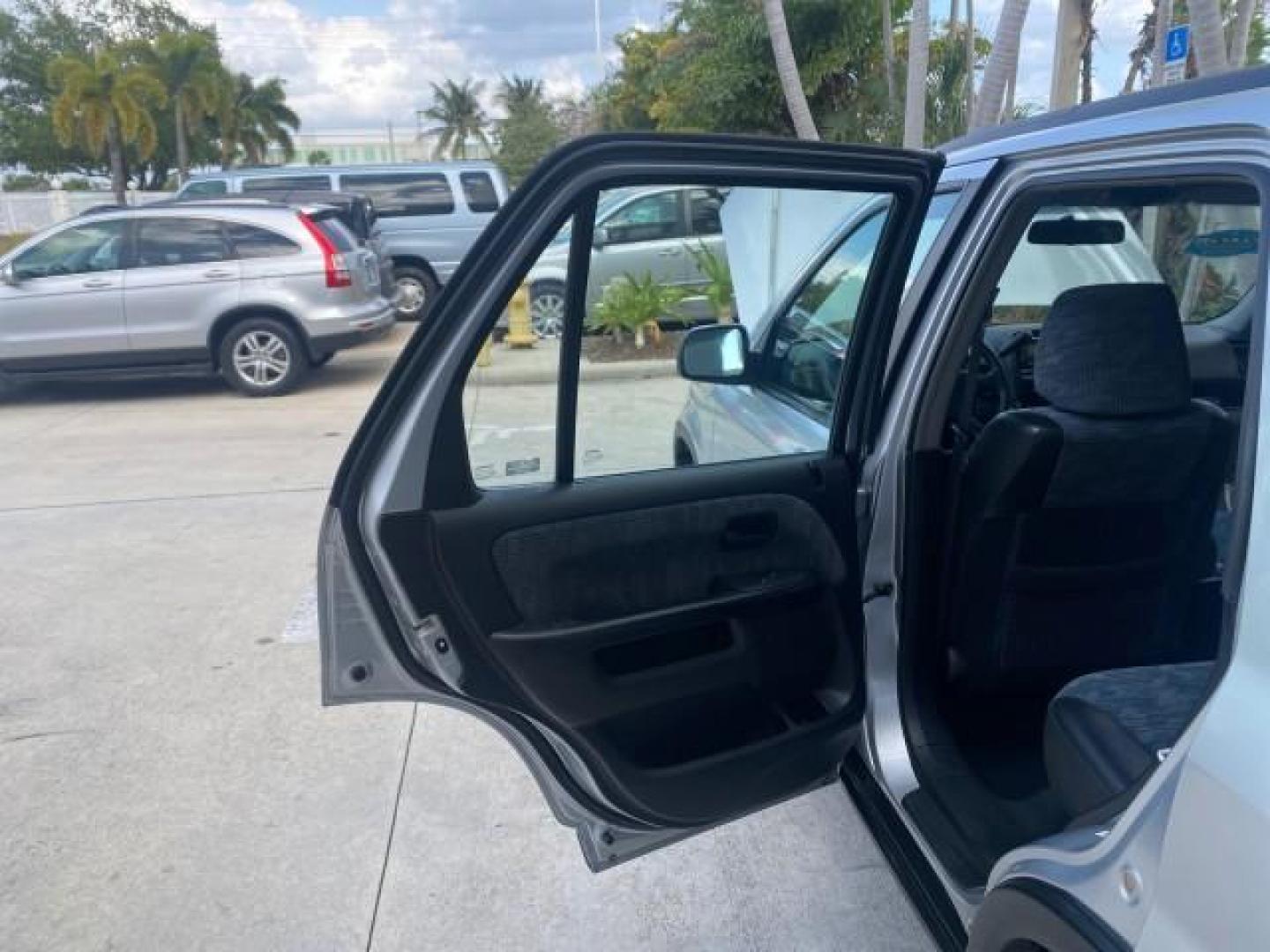 2004 Satin Silver Metallic /Black Honda CR-V LX LOW MILES 44,323 (SHSRD684X4U) with an 2.4L DOHC PGM-FI 16-Valve i-VTEC I4 Engine engine, Automatic transmission, located at 4701 North Dixie Hwy, Pompano Beach, FL, 33064, (954) 422-2889, 26.240938, -80.123474 - OUR WEBPAGE FLORIDACARS1.COM HAS OVER 100 PHOTOS AND FREE CARFAX LINK 2004 HONDA CR-V LX VIN: SHSRD684X4U202379 S H S R D 6 8 4 X 4 U 2 0 2 3 7 9 4 DOOR WAGON/SPORT UTILITY 2.4L I4 F SOHC GASOLINE 29 MPG FRONT WHEEL DRIVE Top Features Leatherette and Cloth Basic Features AM/FM Stereo CD Audio Powe - Photo#13