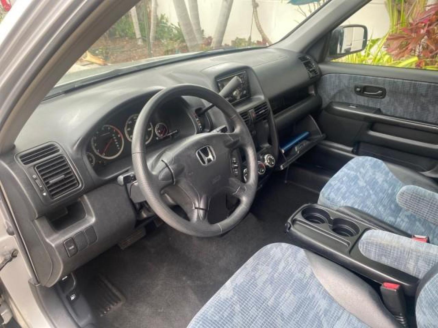 2004 Satin Silver Metallic /Black Honda CR-V LX LOW MILES 44,323 (SHSRD684X4U) with an 2.4L DOHC PGM-FI 16-Valve i-VTEC I4 Engine engine, Automatic transmission, located at 4701 North Dixie Hwy, Pompano Beach, FL, 33064, (954) 422-2889, 26.240938, -80.123474 - OUR WEBPAGE FLORIDACARS1.COM HAS OVER 100 PHOTOS AND FREE CARFAX LINK 2004 HONDA CR-V LX VIN: SHSRD684X4U202379 S H S R D 6 8 4 X 4 U 2 0 2 3 7 9 4 DOOR WAGON/SPORT UTILITY 2.4L I4 F SOHC GASOLINE 29 MPG FRONT WHEEL DRIVE Top Features Leatherette and Cloth Basic Features AM/FM Stereo CD Audio Powe - Photo#33