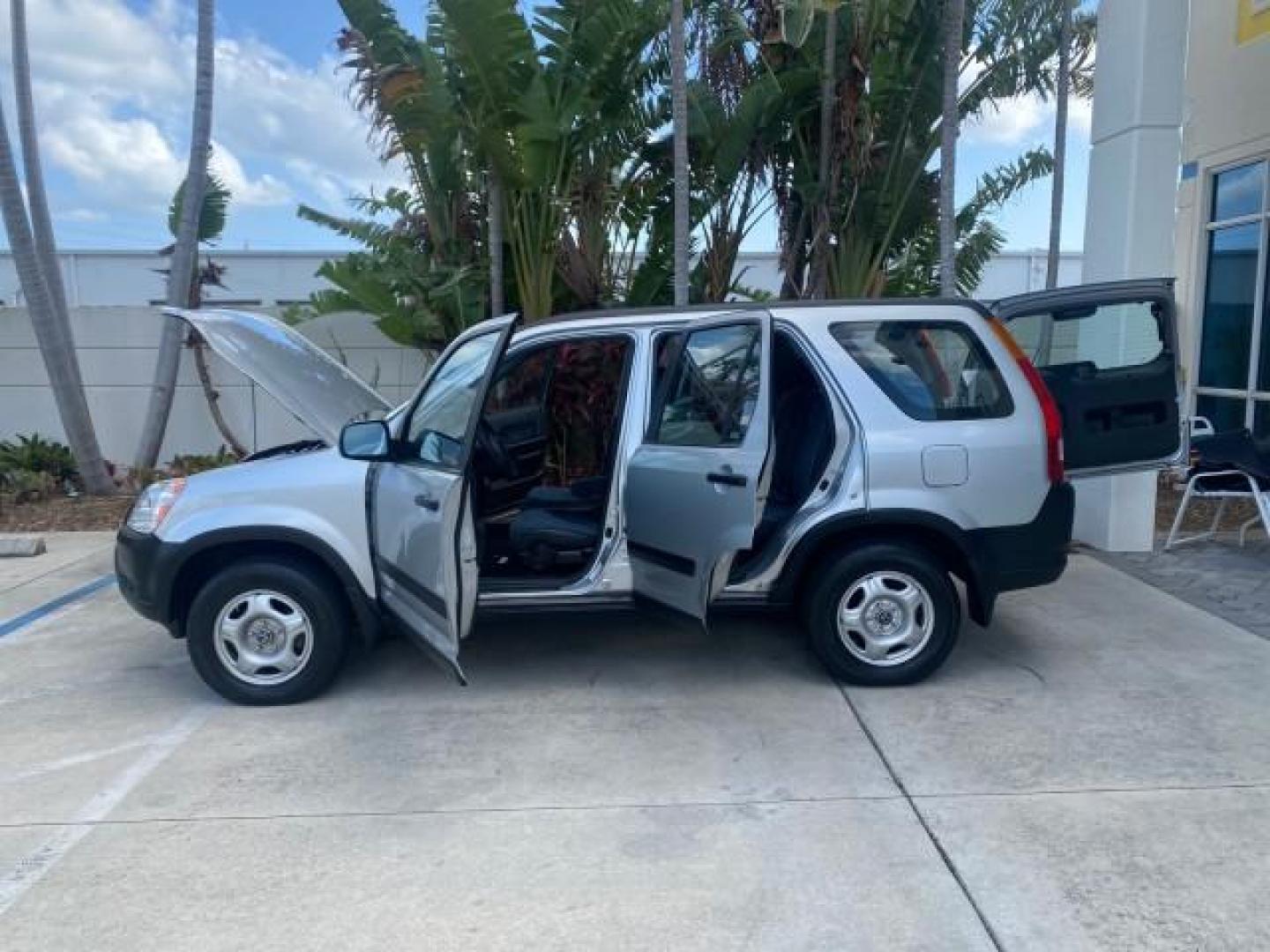 2004 Satin Silver Metallic /Black Honda CR-V LX LOW MILES 44,323 (SHSRD684X4U) with an 2.4L DOHC PGM-FI 16-Valve i-VTEC I4 Engine engine, Automatic transmission, located at 4701 North Dixie Hwy, Pompano Beach, FL, 33064, (954) 422-2889, 26.240938, -80.123474 - OUR WEBPAGE FLORIDACARS1.COM HAS OVER 100 PHOTOS AND FREE CARFAX LINK 2004 HONDA CR-V LX VIN: SHSRD684X4U202379 S H S R D 6 8 4 X 4 U 2 0 2 3 7 9 4 DOOR WAGON/SPORT UTILITY 2.4L I4 F SOHC GASOLINE 29 MPG FRONT WHEEL DRIVE Top Features Leatherette and Cloth Basic Features AM/FM Stereo CD Audio Powe - Photo#8