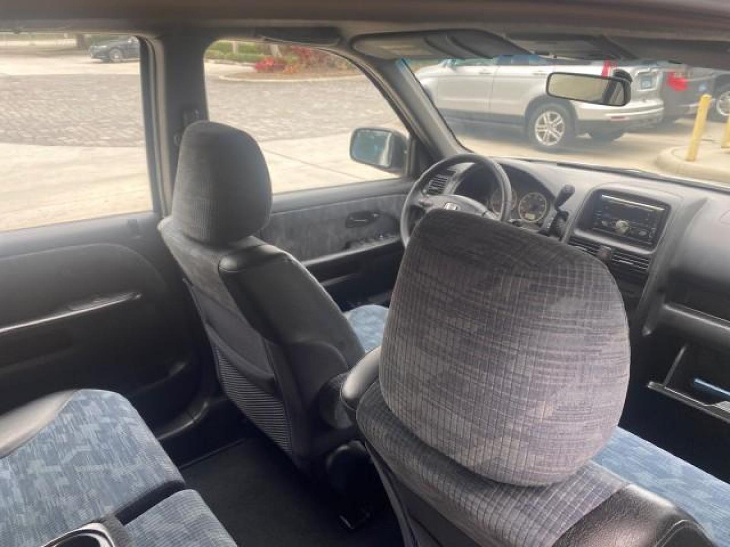 2004 Satin Silver Metallic /Black Honda CR-V LX LOW MILES 44,323 (SHSRD684X4U) with an 2.4L DOHC PGM-FI 16-Valve i-VTEC I4 Engine engine, Automatic transmission, located at 4701 North Dixie Hwy, Pompano Beach, FL, 33064, (954) 422-2889, 26.240938, -80.123474 - OUR WEBPAGE FLORIDACARS1.COM HAS OVER 100 PHOTOS AND FREE CARFAX LINK 2004 HONDA CR-V LX VIN: SHSRD684X4U202379 S H S R D 6 8 4 X 4 U 2 0 2 3 7 9 4 DOOR WAGON/SPORT UTILITY 2.4L I4 F SOHC GASOLINE 29 MPG FRONT WHEEL DRIVE Top Features Leatherette and Cloth Basic Features AM/FM Stereo CD Audio Powe - Photo#89