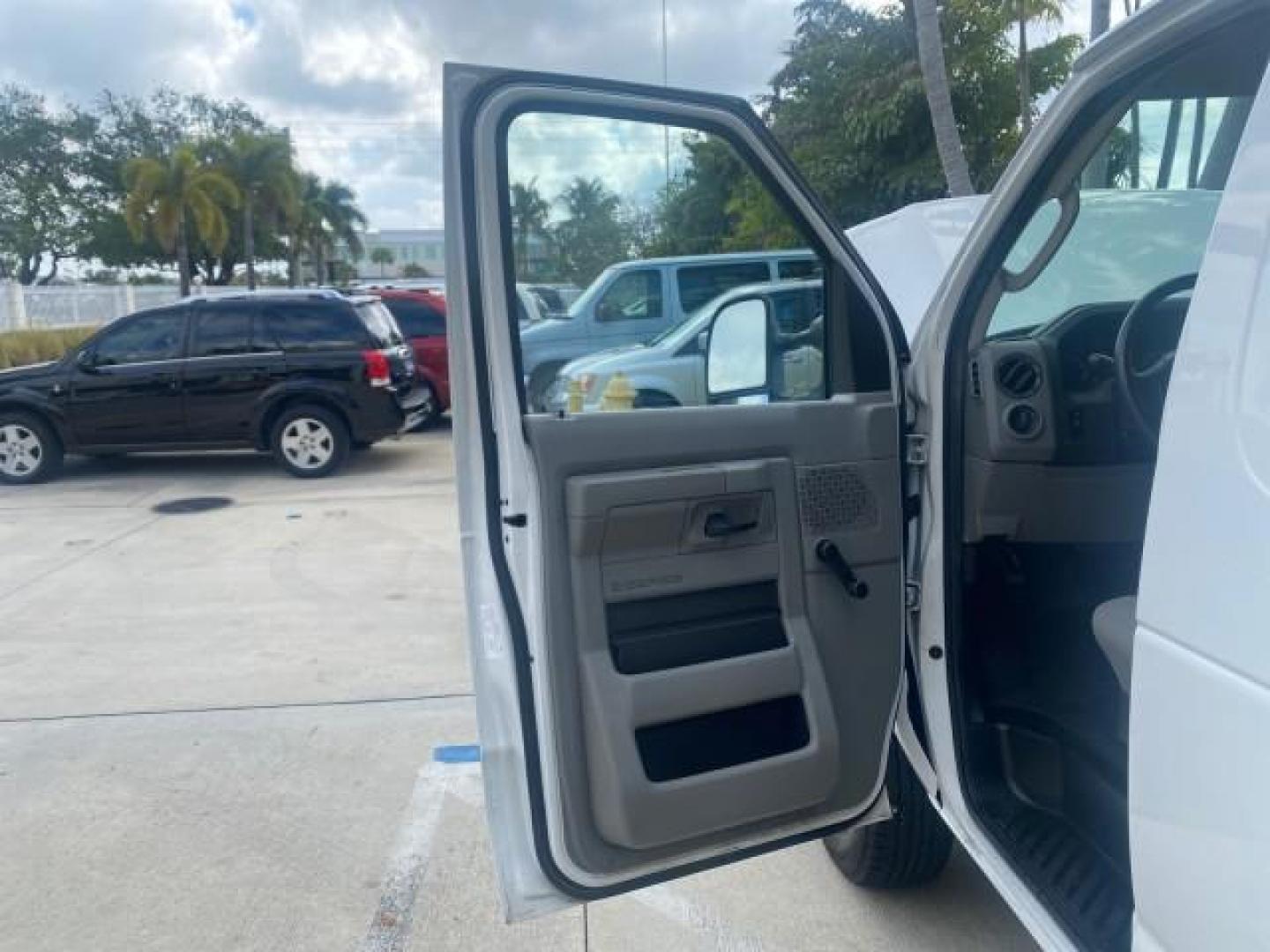 2010 Oxford White /Medium Flint Ford Econoline Cargo Van ext. low miles 54,224 (1FTSS3EL1AD) with an 5.4L SOHC EFI Flex-Fuel V8 Engine engine, Automatic transmission, located at 4701 North Dixie Hwy, Pompano Beach, FL, 33064, (954) 422-2889, 26.240938, -80.123474 - OUR WEBPAGE FLORIDACARS1.COM HAS OVER 100 PHOTOS AND FREE CARFAX LINK 2010 FORD E-SERIES E-350 SD EXT HARD TO FIND! VIN: 1FTSS3EL1ADA67398 1 F T S S 3 E L 1 A D A 6 7 3 9 8 VAN 5.4L V8 F SOHC 16V GASOLINE DUAL AC RARE OPTION. REAR WHEEL DRIVE Top Features Cloth Seats Basic Features ABS Brakes Air Co - Photo#9