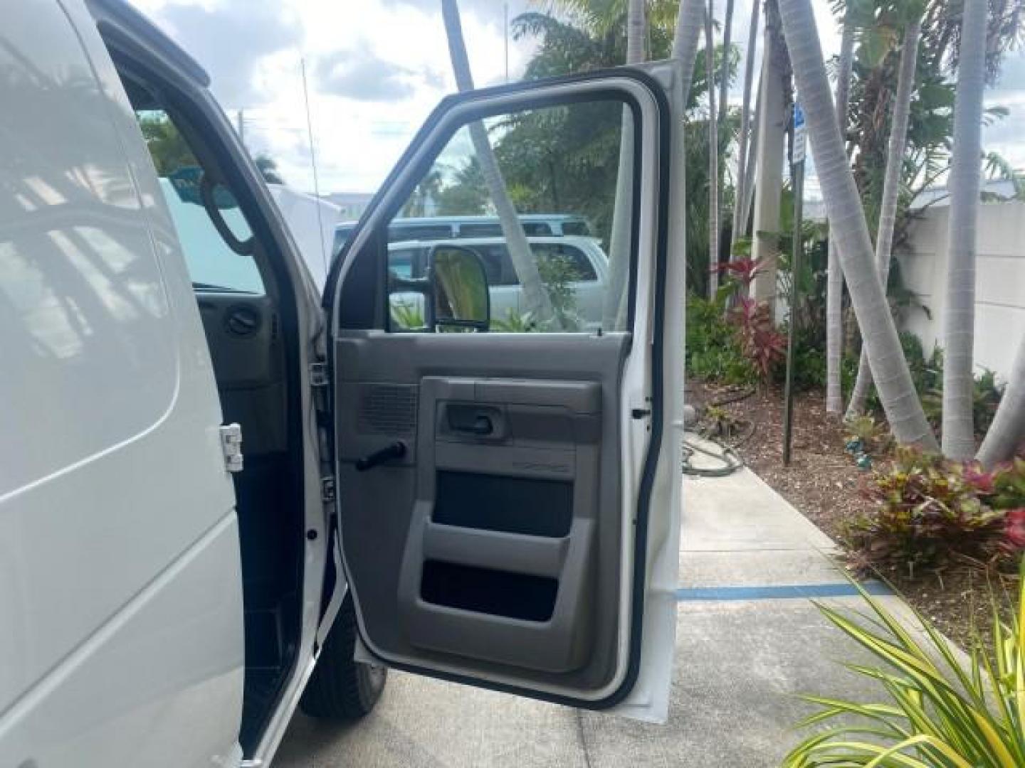 2010 Oxford White /Medium Flint Ford Econoline Cargo Van ext. low miles 54,224 (1FTSS3EL1AD) with an 5.4L SOHC EFI Flex-Fuel V8 Engine engine, Automatic transmission, located at 4701 North Dixie Hwy, Pompano Beach, FL, 33064, (954) 422-2889, 26.240938, -80.123474 - OUR WEBPAGE FLORIDACARS1.COM HAS OVER 100 PHOTOS AND FREE CARFAX LINK 2010 FORD E-SERIES E-350 SD EXT HARD TO FIND! VIN: 1FTSS3EL1ADA67398 1 F T S S 3 E L 1 A D A 6 7 3 9 8 VAN 5.4L V8 F SOHC 16V GASOLINE DUAL AC RARE OPTION. REAR WHEEL DRIVE Top Features Cloth Seats Basic Features ABS Brakes Air Co - Photo#11