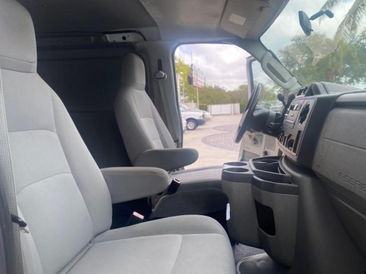 2010 Oxford White /Medium Flint Ford Econoline Cargo Van ext. low miles 54,224 (1FTSS3EL1AD) with an 5.4L SOHC EFI Flex-Fuel V8 Engine engine, Automatic transmission, located at 4701 North Dixie Hwy, Pompano Beach, FL, 33064, (954) 422-2889, 26.240938, -80.123474 - OUR WEBPAGE FLORIDACARS1.COM HAS OVER 100 PHOTOS AND FREE CARFAX LINK 2010 FORD E-SERIES E-350 SD EXT HARD TO FIND! VIN: 1FTSS3EL1ADA67398 1 F T S S 3 E L 1 A D A 6 7 3 9 8 VAN 5.4L V8 F SOHC 16V GASOLINE DUAL AC RARE OPTION. REAR WHEEL DRIVE Top Features Cloth Seats Basic Features ABS Brakes Air Co - Photo#12