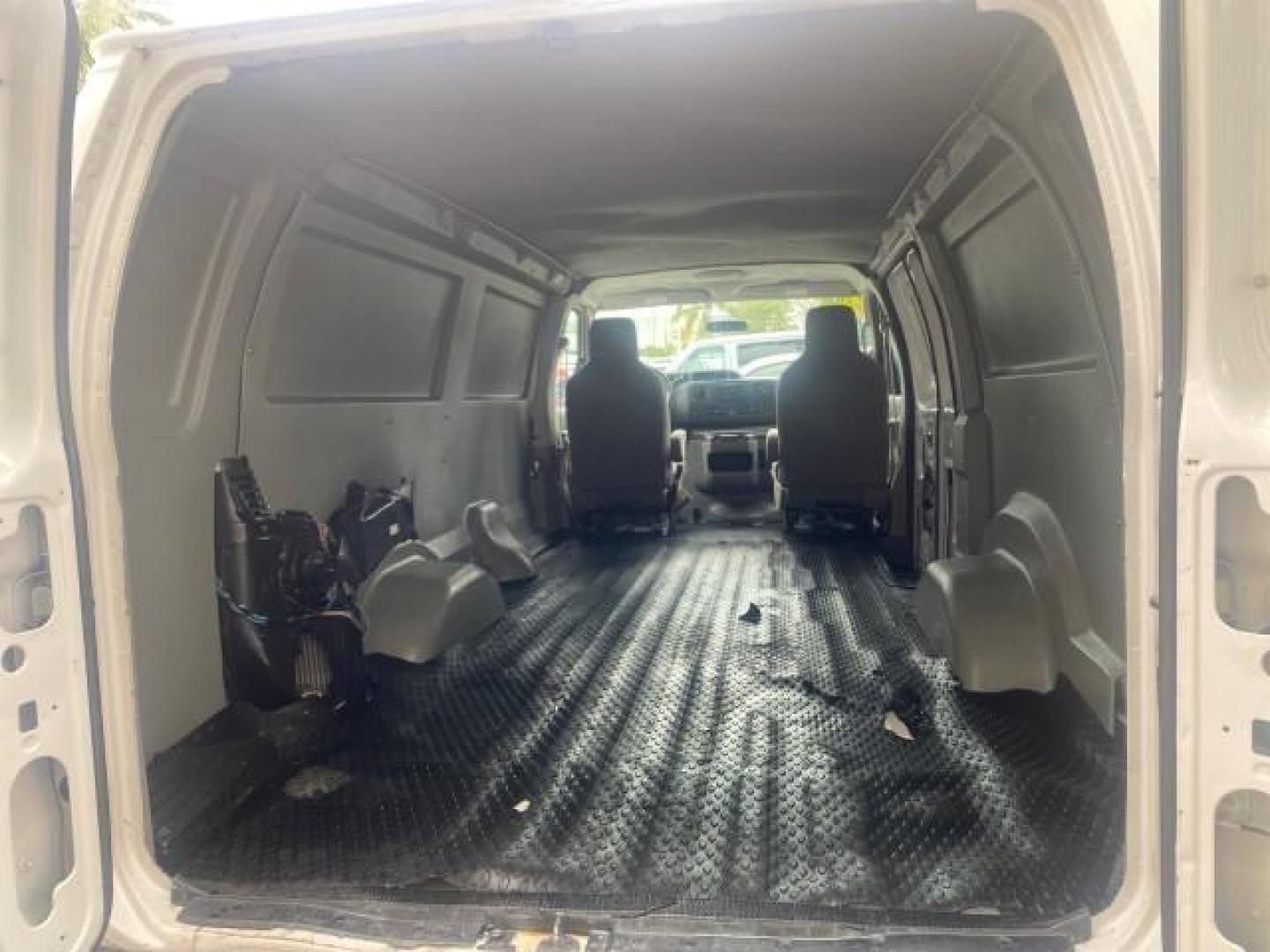 2010 Oxford White /Medium Flint Ford Econoline Cargo Van ext. low miles 54,224 (1FTSS3EL1AD) with an 5.4L SOHC EFI Flex-Fuel V8 Engine engine, Automatic transmission, located at 4701 North Dixie Hwy, Pompano Beach, FL, 33064, (954) 422-2889, 26.240938, -80.123474 - OUR WEBPAGE FLORIDACARS1.COM HAS OVER 100 PHOTOS AND FREE CARFAX LINK 2010 FORD E-SERIES E-350 SD EXT HARD TO FIND! VIN: 1FTSS3EL1ADA67398 1 F T S S 3 E L 1 A D A 6 7 3 9 8 VAN 5.4L V8 F SOHC 16V GASOLINE DUAL AC RARE OPTION. REAR WHEEL DRIVE Top Features Cloth Seats Basic Features ABS Brakes Air Co - Photo#71