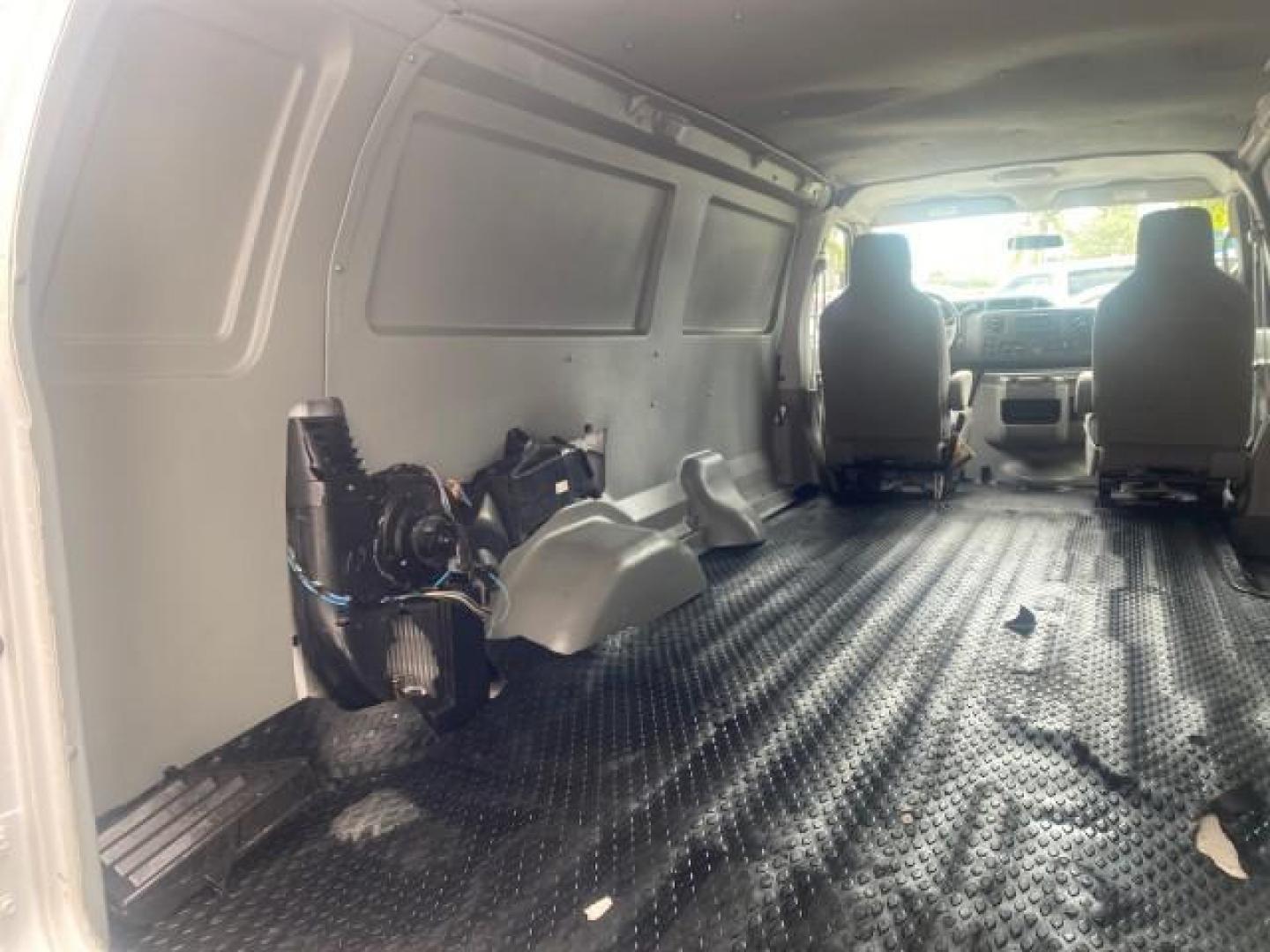 2010 Oxford White /Medium Flint Ford Econoline Cargo Van ext. low miles 54,224 (1FTSS3EL1AD) with an 5.4L SOHC EFI Flex-Fuel V8 Engine engine, Automatic transmission, located at 4701 North Dixie Hwy, Pompano Beach, FL, 33064, (954) 422-2889, 26.240938, -80.123474 - OUR WEBPAGE FLORIDACARS1.COM HAS OVER 100 PHOTOS AND FREE CARFAX LINK 2010 FORD E-SERIES E-350 SD EXT HARD TO FIND! VIN: 1FTSS3EL1ADA67398 1 F T S S 3 E L 1 A D A 6 7 3 9 8 VAN 5.4L V8 F SOHC 16V GASOLINE DUAL AC RARE OPTION. REAR WHEEL DRIVE Top Features Cloth Seats Basic Features ABS Brakes Air Co - Photo#72