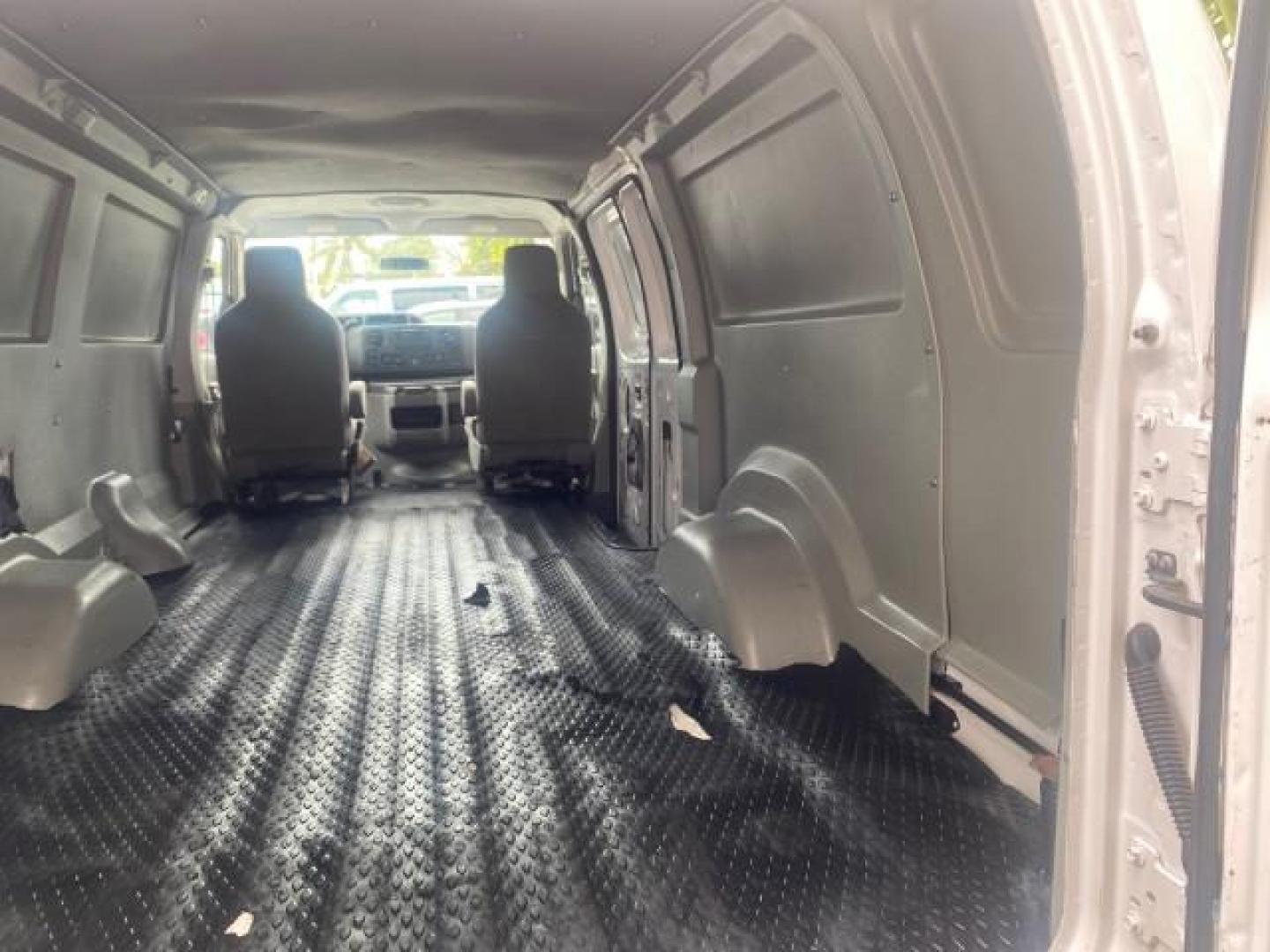 2010 Oxford White /Medium Flint Ford Econoline Cargo Van ext. low miles 54,224 (1FTSS3EL1AD) with an 5.4L SOHC EFI Flex-Fuel V8 Engine engine, Automatic transmission, located at 4701 North Dixie Hwy, Pompano Beach, FL, 33064, (954) 422-2889, 26.240938, -80.123474 - OUR WEBPAGE FLORIDACARS1.COM HAS OVER 100 PHOTOS AND FREE CARFAX LINK 2010 FORD E-SERIES E-350 SD EXT HARD TO FIND! VIN: 1FTSS3EL1ADA67398 1 F T S S 3 E L 1 A D A 6 7 3 9 8 VAN 5.4L V8 F SOHC 16V GASOLINE DUAL AC RARE OPTION. REAR WHEEL DRIVE Top Features Cloth Seats Basic Features ABS Brakes Air Co - Photo#73