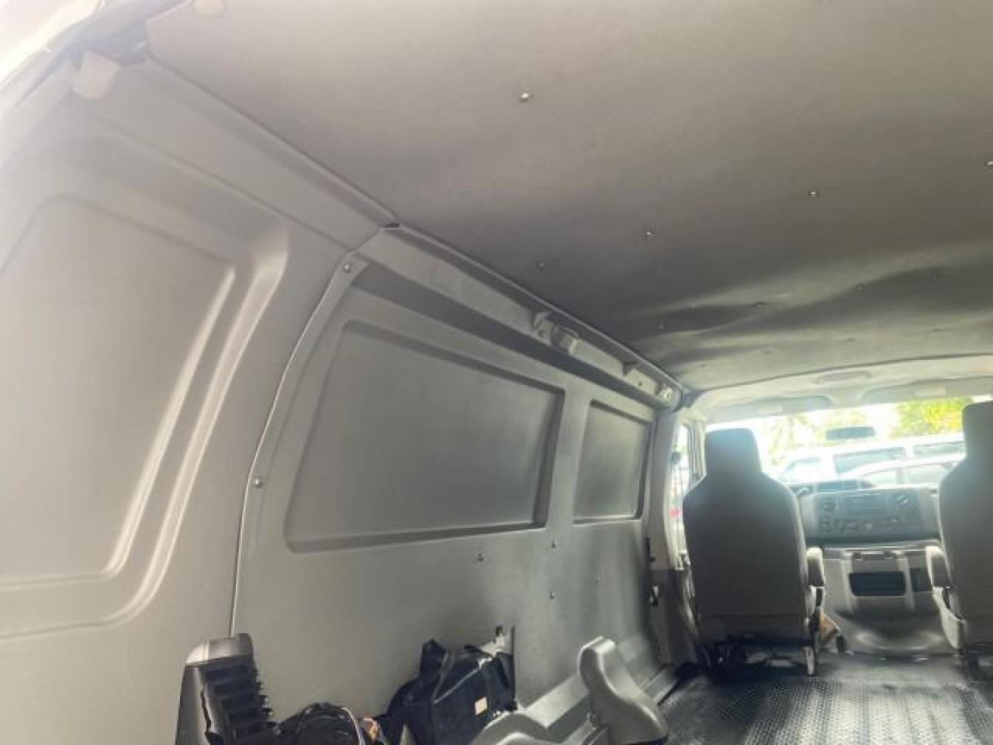 2010 Oxford White /Medium Flint Ford Econoline Cargo Van ext. low miles 54,224 (1FTSS3EL1AD) with an 5.4L SOHC EFI Flex-Fuel V8 Engine engine, Automatic transmission, located at 4701 North Dixie Hwy, Pompano Beach, FL, 33064, (954) 422-2889, 26.240938, -80.123474 - OUR WEBPAGE FLORIDACARS1.COM HAS OVER 100 PHOTOS AND FREE CARFAX LINK 2010 FORD E-SERIES E-350 SD EXT HARD TO FIND! VIN: 1FTSS3EL1ADA67398 1 F T S S 3 E L 1 A D A 6 7 3 9 8 VAN 5.4L V8 F SOHC 16V GASOLINE DUAL AC RARE OPTION. REAR WHEEL DRIVE Top Features Cloth Seats Basic Features ABS Brakes Air Co - Photo#74