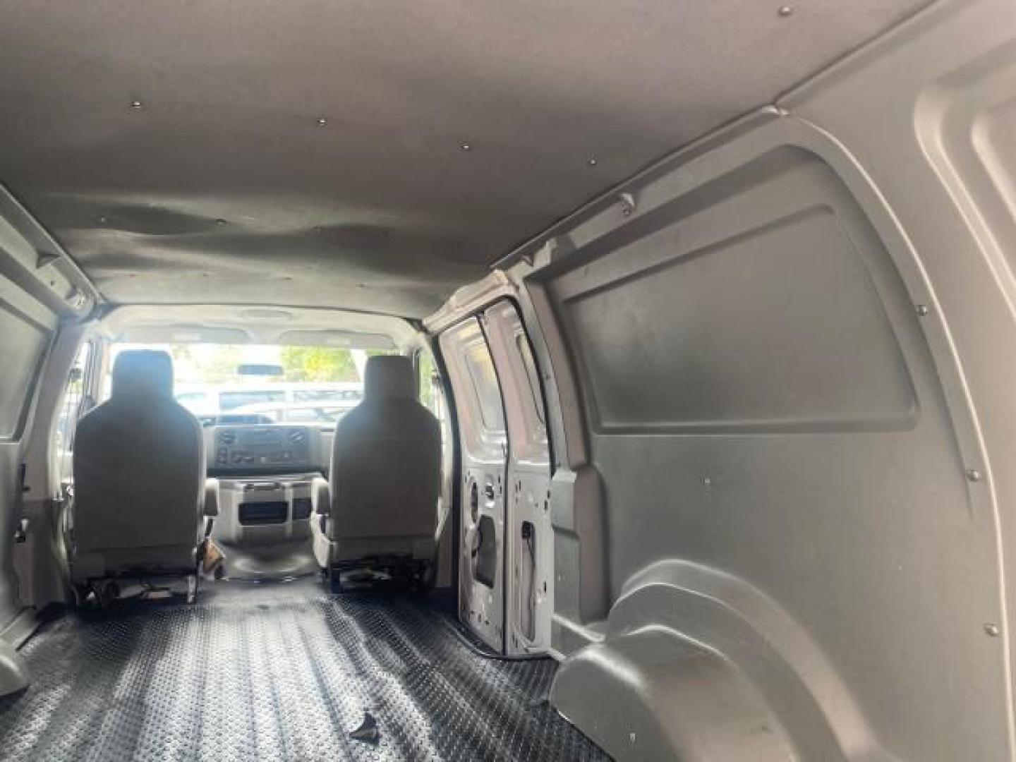 2010 Oxford White /Medium Flint Ford Econoline Cargo Van ext. low miles 54,224 (1FTSS3EL1AD) with an 5.4L SOHC EFI Flex-Fuel V8 Engine engine, Automatic transmission, located at 4701 North Dixie Hwy, Pompano Beach, FL, 33064, (954) 422-2889, 26.240938, -80.123474 - OUR WEBPAGE FLORIDACARS1.COM HAS OVER 100 PHOTOS AND FREE CARFAX LINK 2010 FORD E-SERIES E-350 SD EXT HARD TO FIND! VIN: 1FTSS3EL1ADA67398 1 F T S S 3 E L 1 A D A 6 7 3 9 8 VAN 5.4L V8 F SOHC 16V GASOLINE DUAL AC RARE OPTION. REAR WHEEL DRIVE Top Features Cloth Seats Basic Features ABS Brakes Air Co - Photo#75