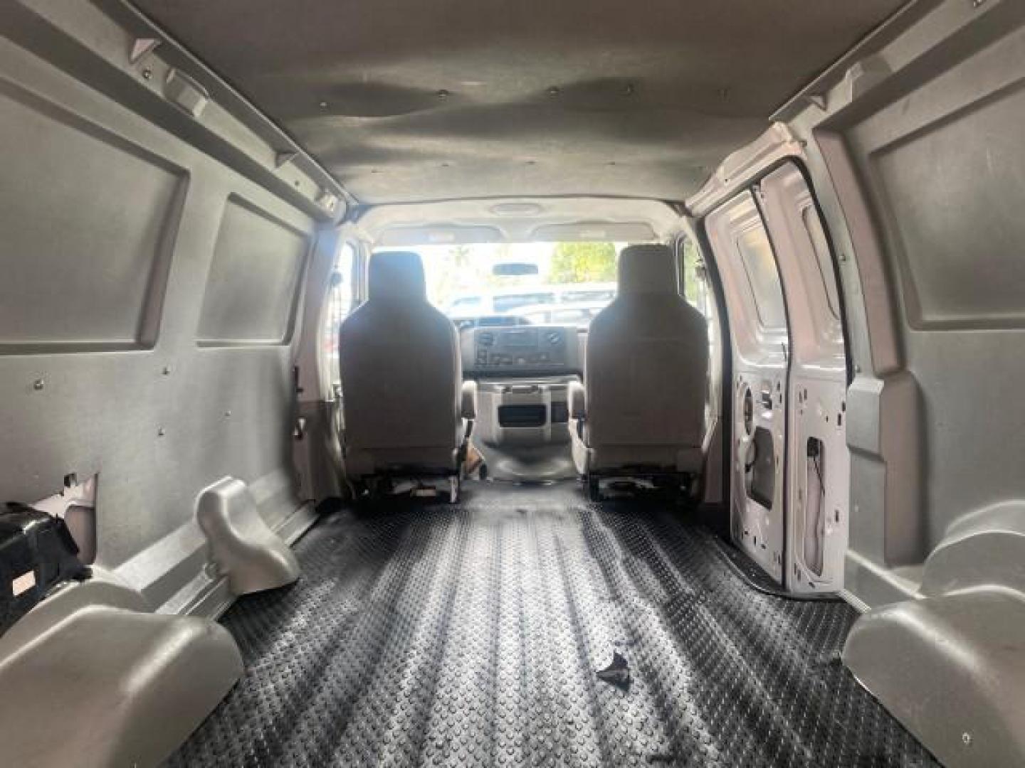2010 Oxford White /Medium Flint Ford Econoline Cargo Van ext. low miles 54,224 (1FTSS3EL1AD) with an 5.4L SOHC EFI Flex-Fuel V8 Engine engine, Automatic transmission, located at 4701 North Dixie Hwy, Pompano Beach, FL, 33064, (954) 422-2889, 26.240938, -80.123474 - OUR WEBPAGE FLORIDACARS1.COM HAS OVER 100 PHOTOS AND FREE CARFAX LINK 2010 FORD E-SERIES E-350 SD EXT HARD TO FIND! VIN: 1FTSS3EL1ADA67398 1 F T S S 3 E L 1 A D A 6 7 3 9 8 VAN 5.4L V8 F SOHC 16V GASOLINE DUAL AC RARE OPTION. REAR WHEEL DRIVE Top Features Cloth Seats Basic Features ABS Brakes Air Co - Photo#79