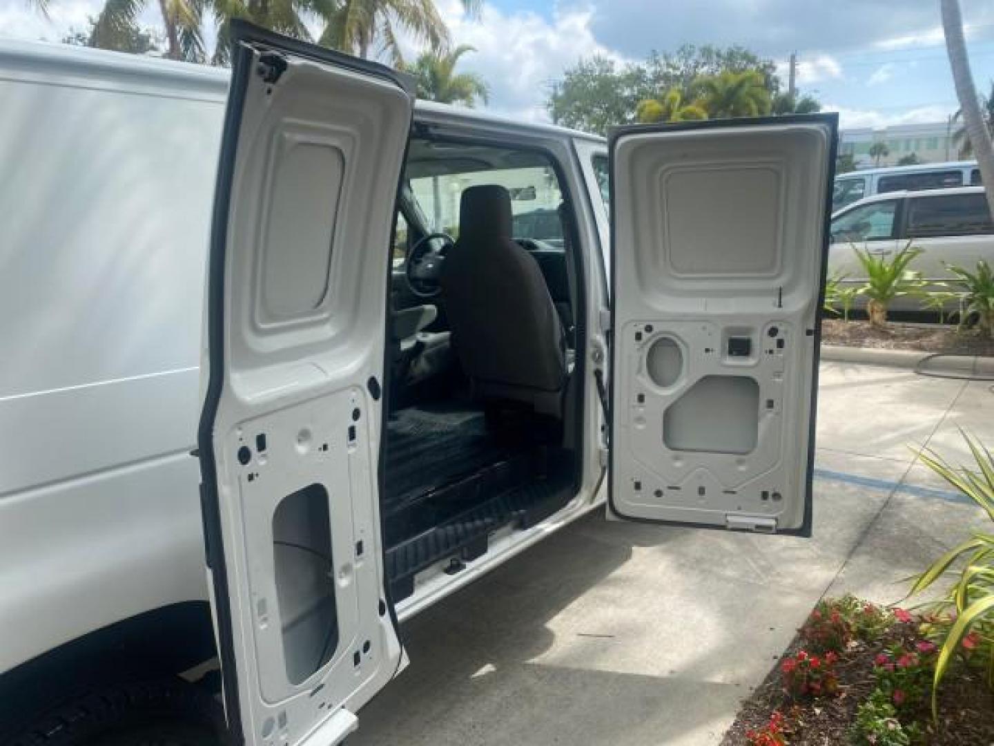 2010 Oxford White /Medium Flint Ford Econoline Cargo Van ext. low miles 54,224 (1FTSS3EL1AD) with an 5.4L SOHC EFI Flex-Fuel V8 Engine engine, Automatic transmission, located at 4701 North Dixie Hwy, Pompano Beach, FL, 33064, (954) 422-2889, 26.240938, -80.123474 - OUR WEBPAGE FLORIDACARS1.COM HAS OVER 100 PHOTOS AND FREE CARFAX LINK 2010 FORD E-SERIES E-350 SD EXT HARD TO FIND! VIN: 1FTSS3EL1ADA67398 1 F T S S 3 E L 1 A D A 6 7 3 9 8 VAN 5.4L V8 F SOHC 16V GASOLINE DUAL AC RARE OPTION. REAR WHEEL DRIVE Top Features Cloth Seats Basic Features ABS Brakes Air Co - Photo#87