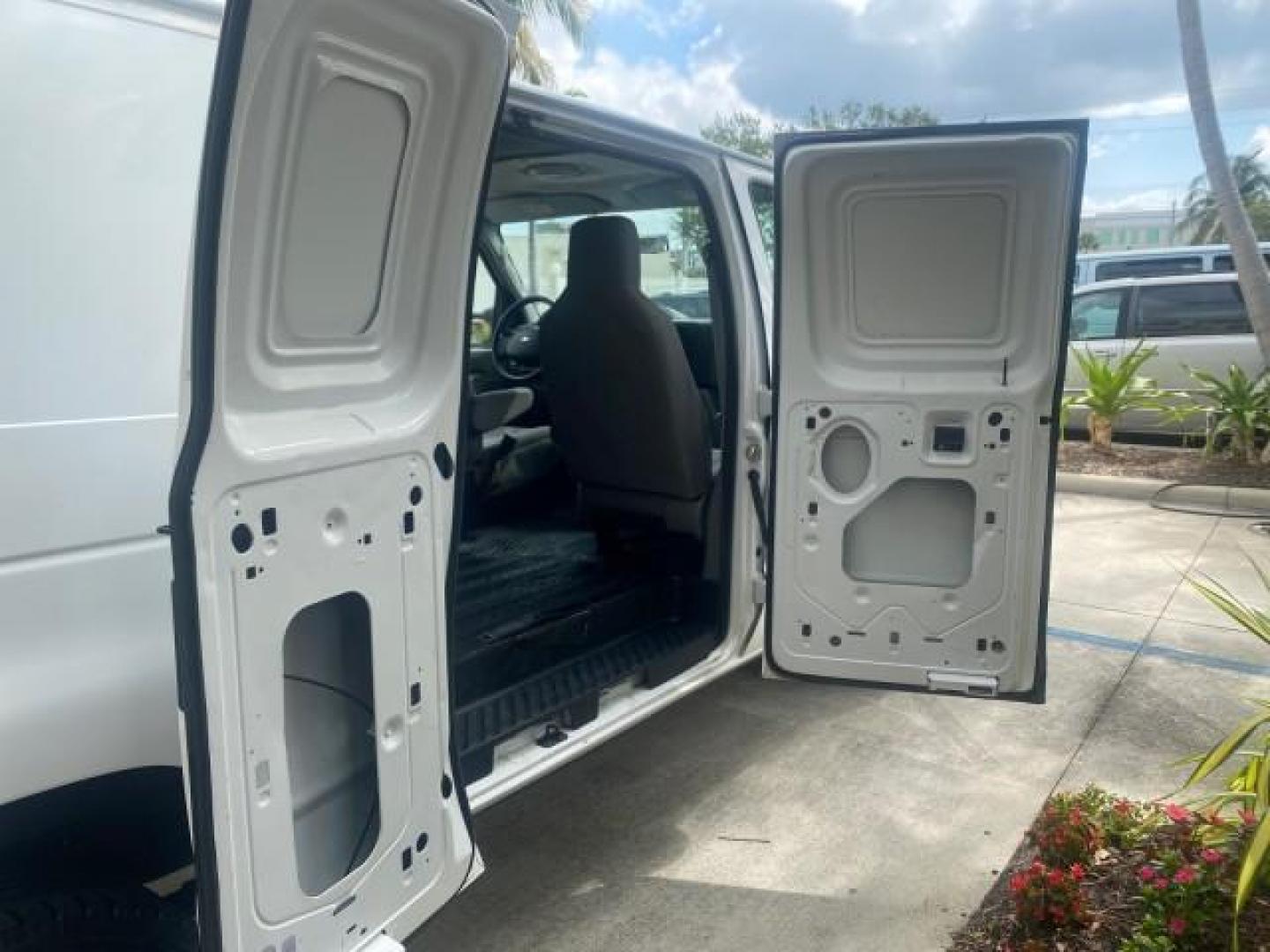 2010 Oxford White /Medium Flint Ford Econoline Cargo Van ext. low miles 54,224 (1FTSS3EL1AD) with an 5.4L SOHC EFI Flex-Fuel V8 Engine engine, Automatic transmission, located at 4701 North Dixie Hwy, Pompano Beach, FL, 33064, (954) 422-2889, 26.240938, -80.123474 - OUR WEBPAGE FLORIDACARS1.COM HAS OVER 100 PHOTOS AND FREE CARFAX LINK 2010 FORD E-SERIES E-350 SD EXT HARD TO FIND! VIN: 1FTSS3EL1ADA67398 1 F T S S 3 E L 1 A D A 6 7 3 9 8 VAN 5.4L V8 F SOHC 16V GASOLINE DUAL AC RARE OPTION. REAR WHEEL DRIVE Top Features Cloth Seats Basic Features ABS Brakes Air Co - Photo#88