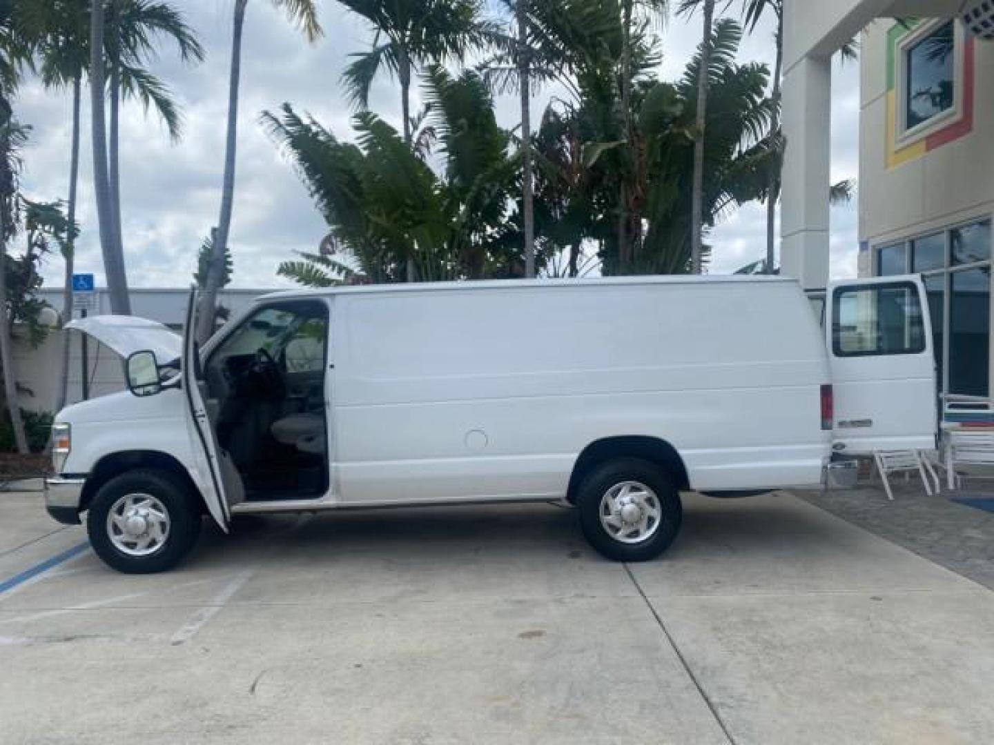2010 Oxford White /Medium Flint Ford Econoline Cargo Van ext. low miles 54,224 (1FTSS3EL1AD) with an 5.4L SOHC EFI Flex-Fuel V8 Engine engine, Automatic transmission, located at 4701 North Dixie Hwy, Pompano Beach, FL, 33064, (954) 422-2889, 26.240938, -80.123474 - OUR WEBPAGE FLORIDACARS1.COM HAS OVER 100 PHOTOS AND FREE CARFAX LINK 2010 FORD E-SERIES E-350 SD EXT HARD TO FIND! VIN: 1FTSS3EL1ADA67398 1 F T S S 3 E L 1 A D A 6 7 3 9 8 VAN 5.4L V8 F SOHC 16V GASOLINE DUAL AC RARE OPTION. REAR WHEEL DRIVE Top Features Cloth Seats Basic Features ABS Brakes Air Co - Photo#8