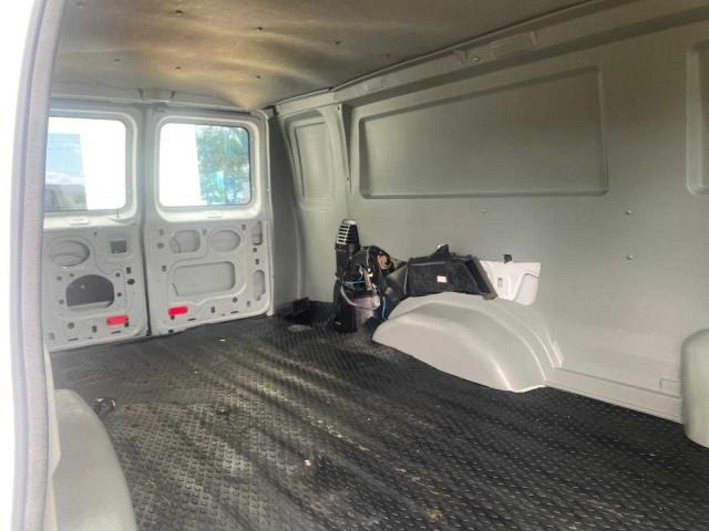 2010 Oxford White /Medium Flint Ford Econoline Cargo Van ext. low miles 54,224 (1FTSS3EL1AD) with an 5.4L SOHC EFI Flex-Fuel V8 Engine engine, Automatic transmission, located at 4701 North Dixie Hwy, Pompano Beach, FL, 33064, (954) 422-2889, 26.240938, -80.123474 - OUR WEBPAGE FLORIDACARS1.COM HAS OVER 100 PHOTOS AND FREE CARFAX LINK 2010 FORD E-SERIES E-350 SD EXT HARD TO FIND! VIN: 1FTSS3EL1ADA67398 1 F T S S 3 E L 1 A D A 6 7 3 9 8 VAN 5.4L V8 F SOHC 16V GASOLINE DUAL AC RARE OPTION. REAR WHEEL DRIVE Top Features Cloth Seats Basic Features ABS Brakes Air Co - Photo#94