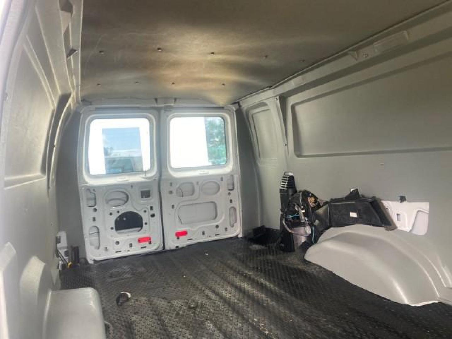 2010 Oxford White /Medium Flint Ford Econoline Cargo Van ext. low miles 54,224 (1FTSS3EL1AD) with an 5.4L SOHC EFI Flex-Fuel V8 Engine engine, Automatic transmission, located at 4701 North Dixie Hwy, Pompano Beach, FL, 33064, (954) 422-2889, 26.240938, -80.123474 - OUR WEBPAGE FLORIDACARS1.COM HAS OVER 100 PHOTOS AND FREE CARFAX LINK 2010 FORD E-SERIES E-350 SD EXT HARD TO FIND! VIN: 1FTSS3EL1ADA67398 1 F T S S 3 E L 1 A D A 6 7 3 9 8 VAN 5.4L V8 F SOHC 16V GASOLINE DUAL AC RARE OPTION. REAR WHEEL DRIVE Top Features Cloth Seats Basic Features ABS Brakes Air Co - Photo#95