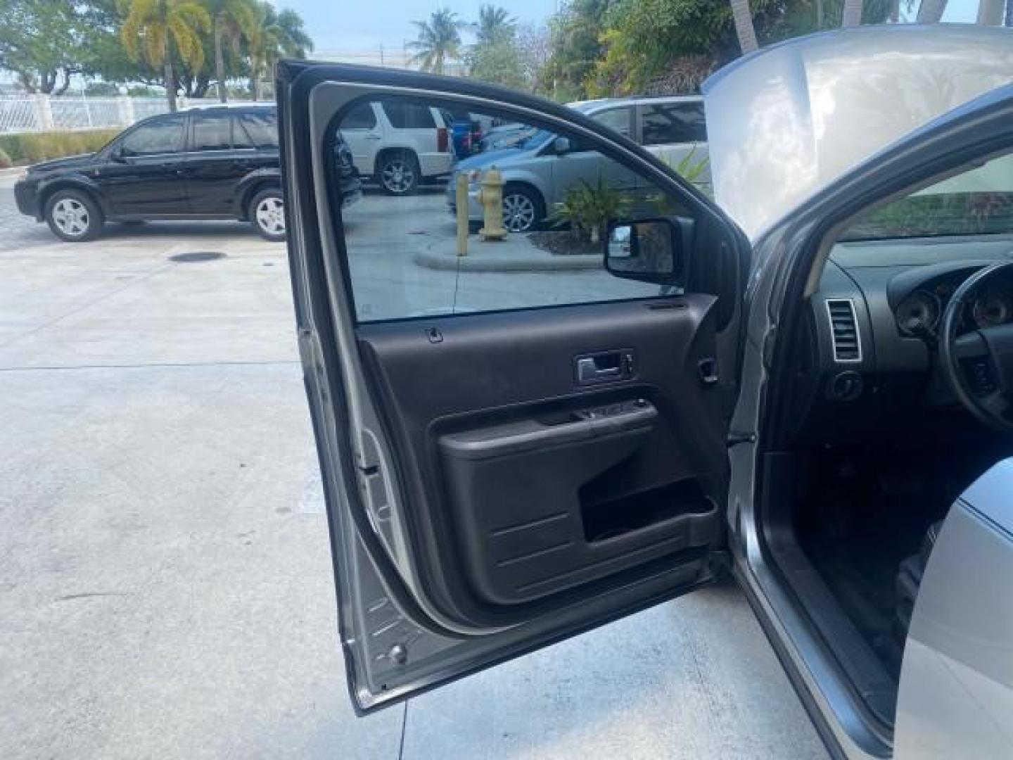 2008 Vapor Silver Metallic /Charcoal Black Ford Edge 1 FL SEL LOW MILES 54,778 (2FMDK38CX8B) with an 3.5L V6 Duratec Engine engine, Automatic transmission, located at 4701 North Dixie Hwy, Pompano Beach, FL, 33064, (954) 422-2889, 26.240938, -80.123474 - OUR WEBPAGE FLORIDACARS1.COM HAS OVER 100 PHOTOS AND FREE CARFAX LINK 2008 FORD EDGE SEL BEAUTIFUL CONDITION! VIN: 2FMDK38CX8BA38384 2 F M D K 3 8 C X 8 B A 3 8 3 8 4 4 DOOR WAGON/SPORT UTILITY 3.5L V6 F GASOLINE FRONT WHEEL DRIVE Top Features Alloy Wheels Premium Package Bluetooth Technology Satell - Photo#9