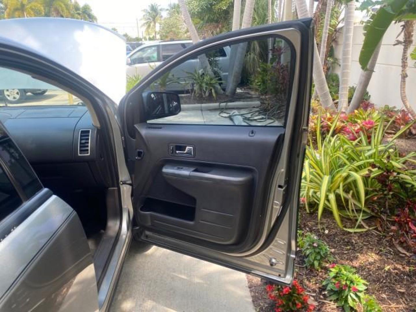 2008 Vapor Silver Metallic /Charcoal Black Ford Edge 1 FL SEL LOW MILES 54,778 (2FMDK38CX8B) with an 3.5L V6 Duratec Engine engine, Automatic transmission, located at 4701 North Dixie Hwy, Pompano Beach, FL, 33064, (954) 422-2889, 26.240938, -80.123474 - OUR WEBPAGE FLORIDACARS1.COM HAS OVER 100 PHOTOS AND FREE CARFAX LINK 2008 FORD EDGE SEL BEAUTIFUL CONDITION! VIN: 2FMDK38CX8BA38384 2 F M D K 3 8 C X 8 B A 3 8 3 8 4 4 DOOR WAGON/SPORT UTILITY 3.5L V6 F GASOLINE FRONT WHEEL DRIVE Top Features Alloy Wheels Premium Package Bluetooth Technology Satell - Photo#11