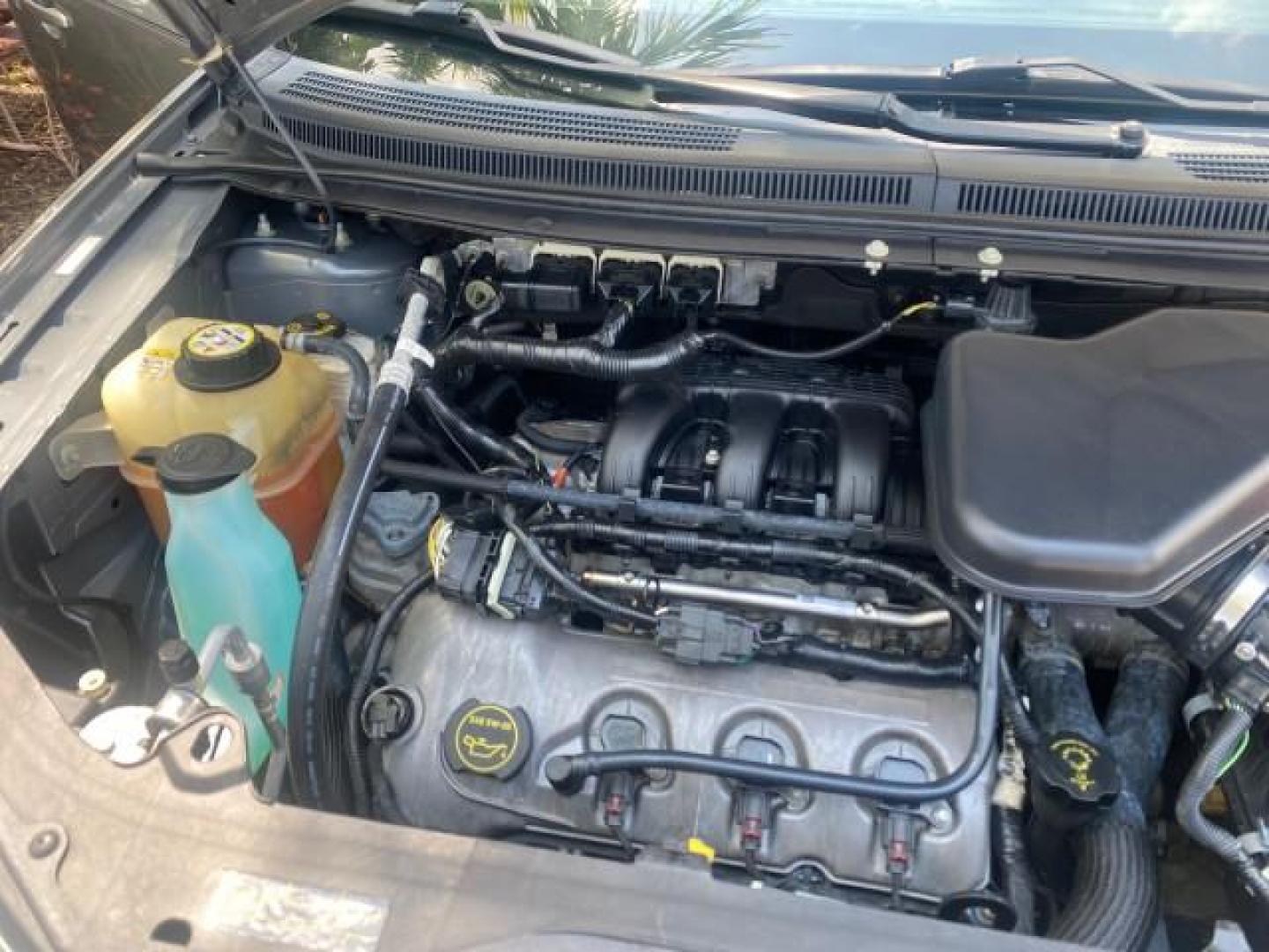 2008 Vapor Silver Metallic /Charcoal Black Ford Edge 1 FL SEL LOW MILES 54,778 (2FMDK38CX8B) with an 3.5L V6 Duratec Engine engine, Automatic transmission, located at 4701 North Dixie Hwy, Pompano Beach, FL, 33064, (954) 422-2889, 26.240938, -80.123474 - OUR WEBPAGE FLORIDACARS1.COM HAS OVER 100 PHOTOS AND FREE CARFAX LINK 2008 FORD EDGE SEL BEAUTIFUL CONDITION! VIN: 2FMDK38CX8BA38384 2 F M D K 3 8 C X 8 B A 3 8 3 8 4 4 DOOR WAGON/SPORT UTILITY 3.5L V6 F GASOLINE FRONT WHEEL DRIVE Top Features Alloy Wheels Premium Package Bluetooth Technology Satell - Photo#24