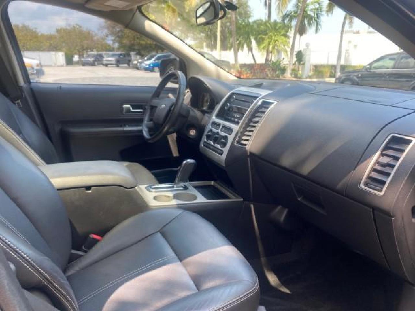 2008 Vapor Silver Metallic /Charcoal Black Ford Edge 1 FL SEL LOW MILES 54,778 (2FMDK38CX8B) with an 3.5L V6 Duratec Engine engine, Automatic transmission, located at 4701 North Dixie Hwy, Pompano Beach, FL, 33064, (954) 422-2889, 26.240938, -80.123474 - OUR WEBPAGE FLORIDACARS1.COM HAS OVER 100 PHOTOS AND FREE CARFAX LINK 2008 FORD EDGE SEL BEAUTIFUL CONDITION! VIN: 2FMDK38CX8BA38384 2 F M D K 3 8 C X 8 B A 3 8 3 8 4 4 DOOR WAGON/SPORT UTILITY 3.5L V6 F GASOLINE FRONT WHEEL DRIVE Top Features Alloy Wheels Premium Package Bluetooth Technology Satell - Photo#93