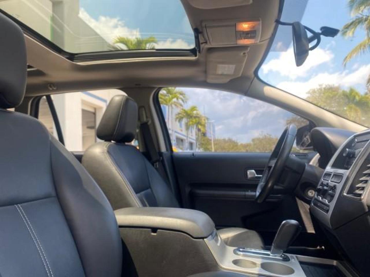 2008 Vapor Silver Metallic /Charcoal Black Ford Edge 1 FL SEL LOW MILES 54,778 (2FMDK38CX8B) with an 3.5L V6 Duratec Engine engine, Automatic transmission, located at 4701 North Dixie Hwy, Pompano Beach, FL, 33064, (954) 422-2889, 26.240938, -80.123474 - OUR WEBPAGE FLORIDACARS1.COM HAS OVER 100 PHOTOS AND FREE CARFAX LINK 2008 FORD EDGE SEL BEAUTIFUL CONDITION! VIN: 2FMDK38CX8BA38384 2 F M D K 3 8 C X 8 B A 3 8 3 8 4 4 DOOR WAGON/SPORT UTILITY 3.5L V6 F GASOLINE FRONT WHEEL DRIVE Top Features Alloy Wheels Premium Package Bluetooth Technology Satell - Photo#95