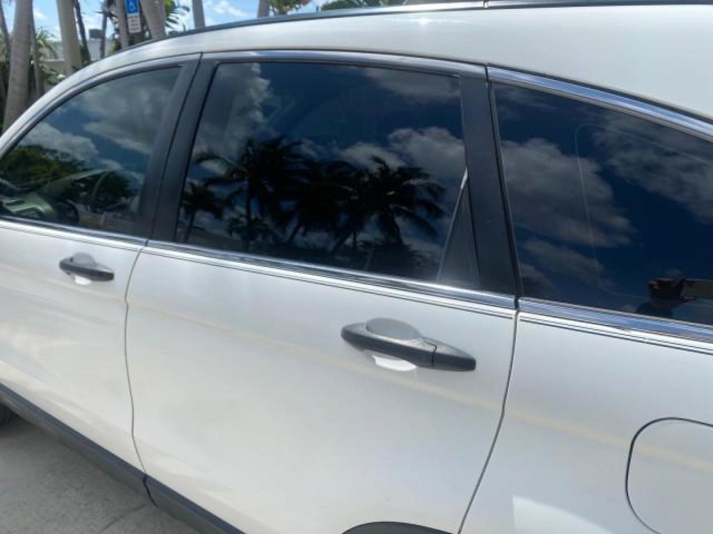 2007 Taffeta White /Gray Honda CR-V LX FL LOW MILES 49,810 (JHLRE38347C) with an 2.4L 4-Cyl Engine engine, Automatic transmission, located at 4701 North Dixie Hwy, Pompano Beach, FL, 33064, (954) 422-2889, 26.240938, -80.123474 - OUR WEBPAGE FLORIDACARS1.COM HAS OVER 100 PHOTOS AND FREE CARFAX LINK 2007 HONDA CR-V LX VIN: JHLRE38347C018084 J H L R E 3 8 3 4 7 C 0 1 8 0 8 4 4 DOOR WAGON/SPORT UTILITY 2.4L I4 F DOHC 16V 30 MPG GASOLINE FRONT WHEEL DRIVE Top Features Cloth Seats Basic Features ABS Brakes Auxiliary Audio Input P - Photo#59