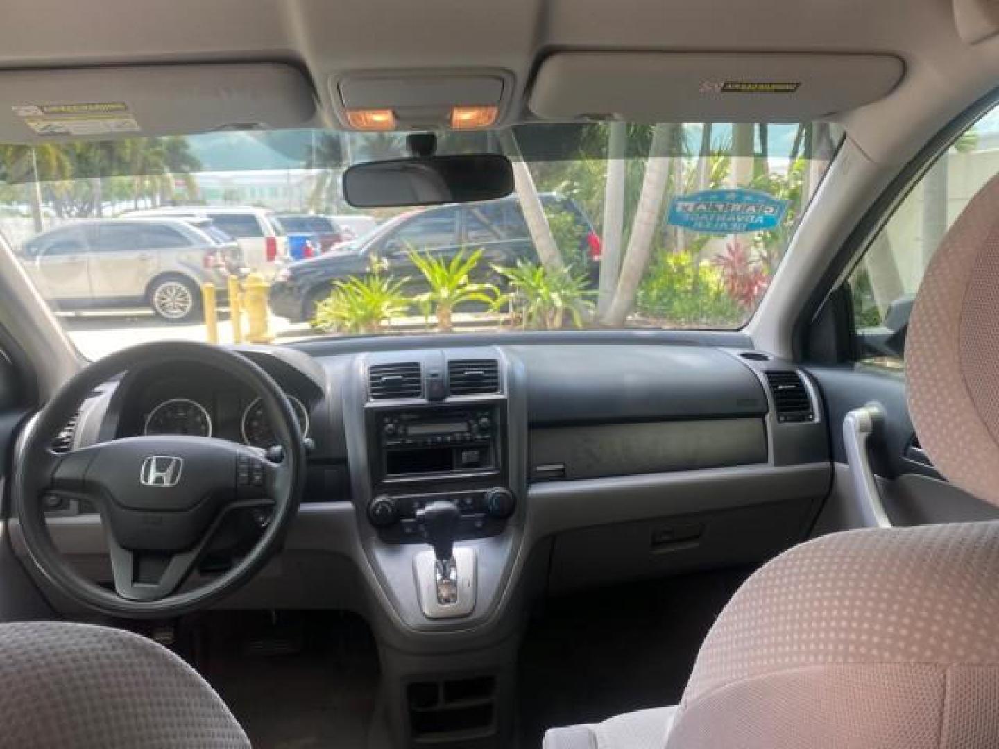2007 Taffeta White /Gray Honda CR-V LX FL LOW MILES 49,810 (JHLRE38347C) with an 2.4L 4-Cyl Engine engine, Automatic transmission, located at 4701 North Dixie Hwy, Pompano Beach, FL, 33064, (954) 422-2889, 26.240938, -80.123474 - OUR WEBPAGE FLORIDACARS1.COM HAS OVER 100 PHOTOS AND FREE CARFAX LINK 2007 HONDA CR-V LX VIN: JHLRE38347C018084 J H L R E 3 8 3 4 7 C 0 1 8 0 8 4 4 DOOR WAGON/SPORT UTILITY 2.4L I4 F DOHC 16V 30 MPG GASOLINE FRONT WHEEL DRIVE Top Features Cloth Seats Basic Features ABS Brakes Auxiliary Audio Input P - Photo#66