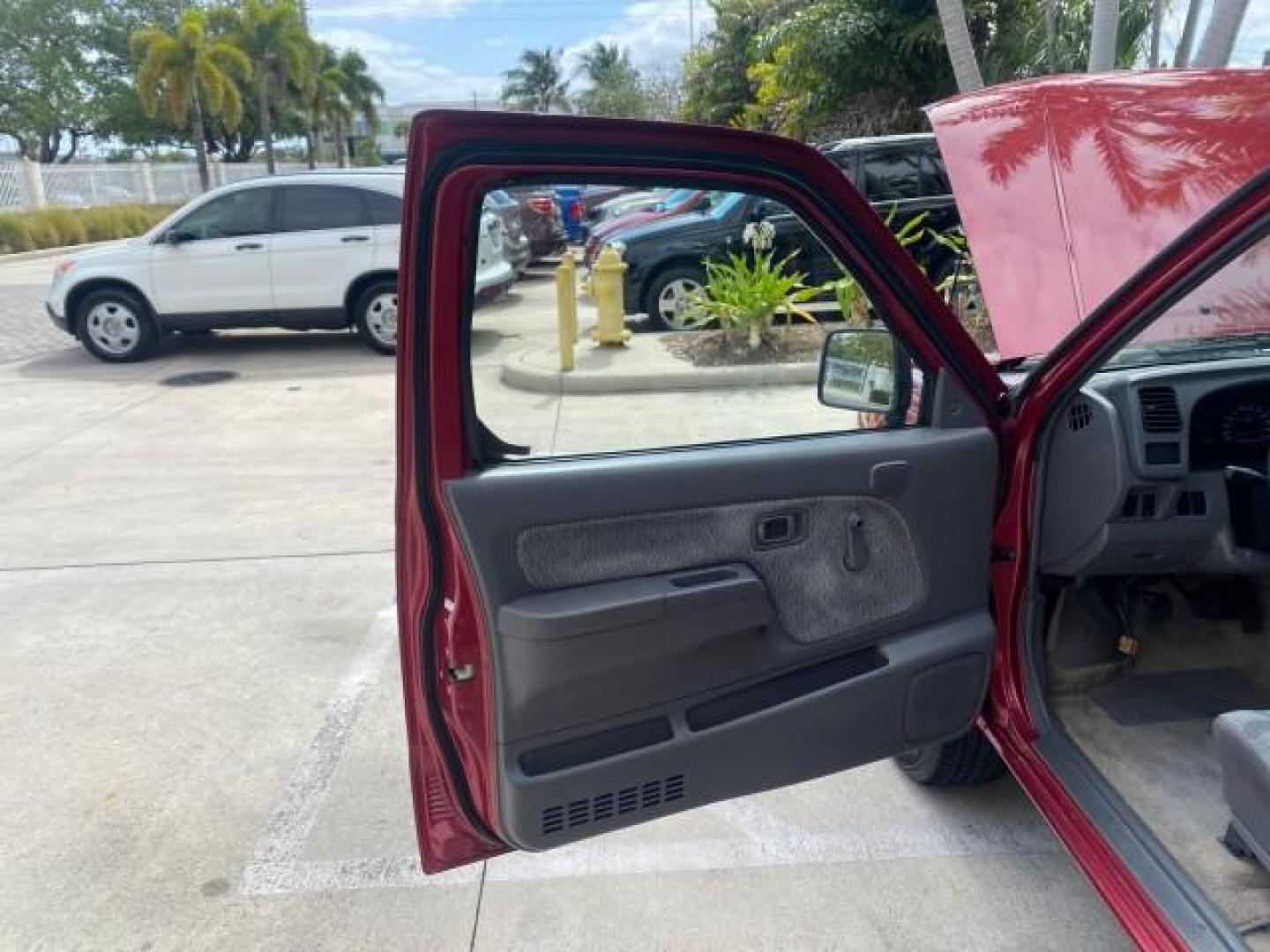 1998 Cheyenne Red (Met) /Gray Nissan Frontier 2WD XE XCAB 5 SPD LOW MILES 69,333 (1N6DD26S8WC) with an 2.4L DOHC SFI 16-Valve 4-Cyl Engine engine, Manual transmission, located at 4701 North Dixie Hwy, Pompano Beach, FL, 33064, (954) 422-2889, 26.240938, -80.123474 - OUR WEBPAGE FLORIDACARS1.COM HAS OVER 100 PHOTOS AND FREE CARFAX LINK 1998 NISSAN FRONTIER XE VIN: 1N6DD26S8WC390232 1 N 6 D D 2 6 S 8 W C 3 9 0 2 3 2 CLUB CAB PICKUP 2.4L I4 F GASOLINE REAR WHEEL DRIVE Top Features Alloy Wheels Cloth Seats Basic Features ABS Brakes AM/FM Stereo Air Conditioning Man - Photo#9