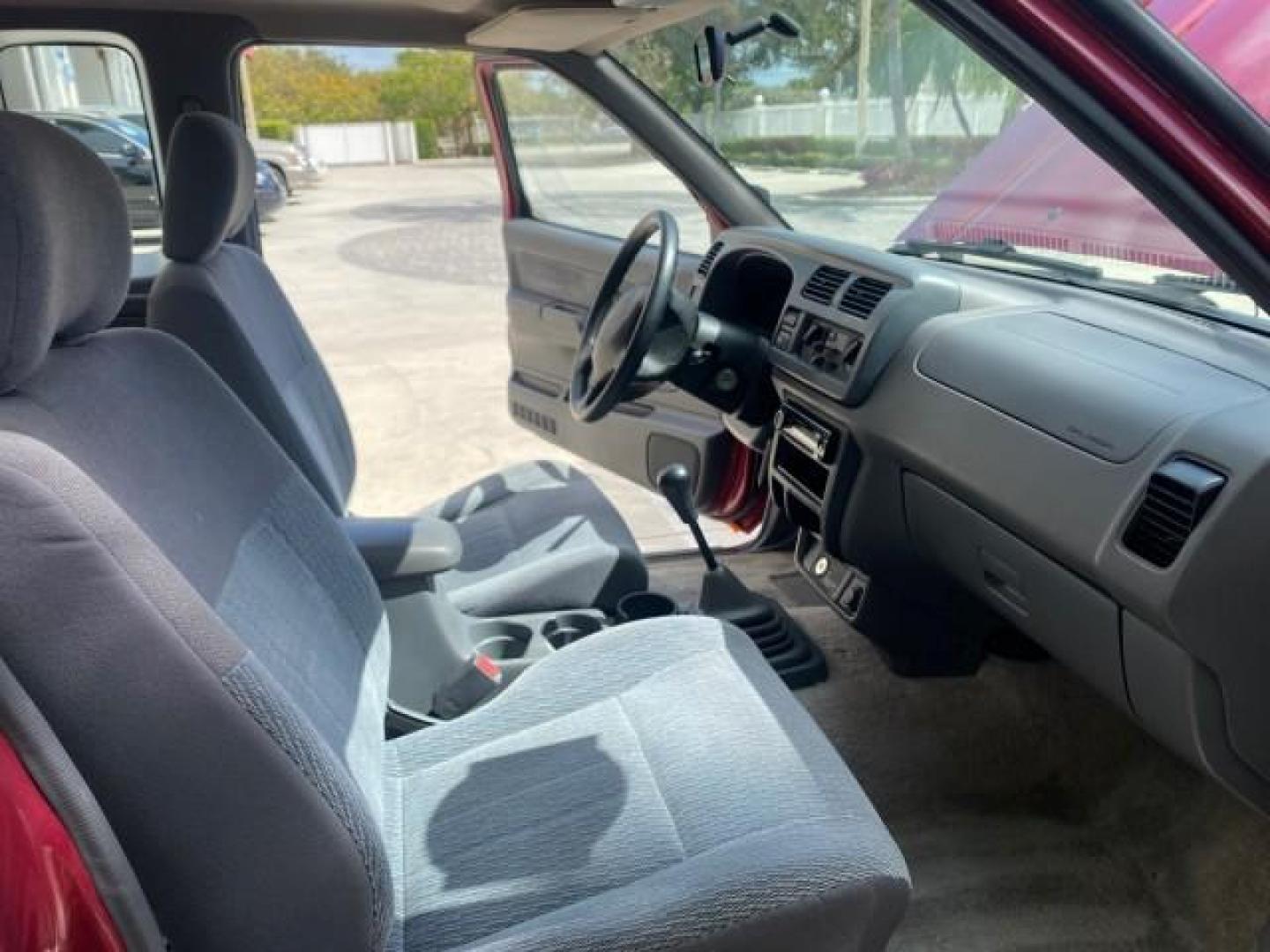 1998 Cheyenne Red (Met) /Gray Nissan Frontier 2WD XE XCAB 5 SPD LOW MILES 69,333 (1N6DD26S8WC) with an 2.4L DOHC SFI 16-Valve 4-Cyl Engine engine, Manual transmission, located at 4701 North Dixie Hwy, Pompano Beach, FL, 33064, (954) 422-2889, 26.240938, -80.123474 - OUR WEBPAGE FLORIDACARS1.COM HAS OVER 100 PHOTOS AND FREE CARFAX LINK 1998 NISSAN FRONTIER XE VIN: 1N6DD26S8WC390232 1 N 6 D D 2 6 S 8 W C 3 9 0 2 3 2 CLUB CAB PICKUP 2.4L I4 F GASOLINE REAR WHEEL DRIVE Top Features Alloy Wheels Cloth Seats Basic Features ABS Brakes AM/FM Stereo Air Conditioning Man - Photo#12