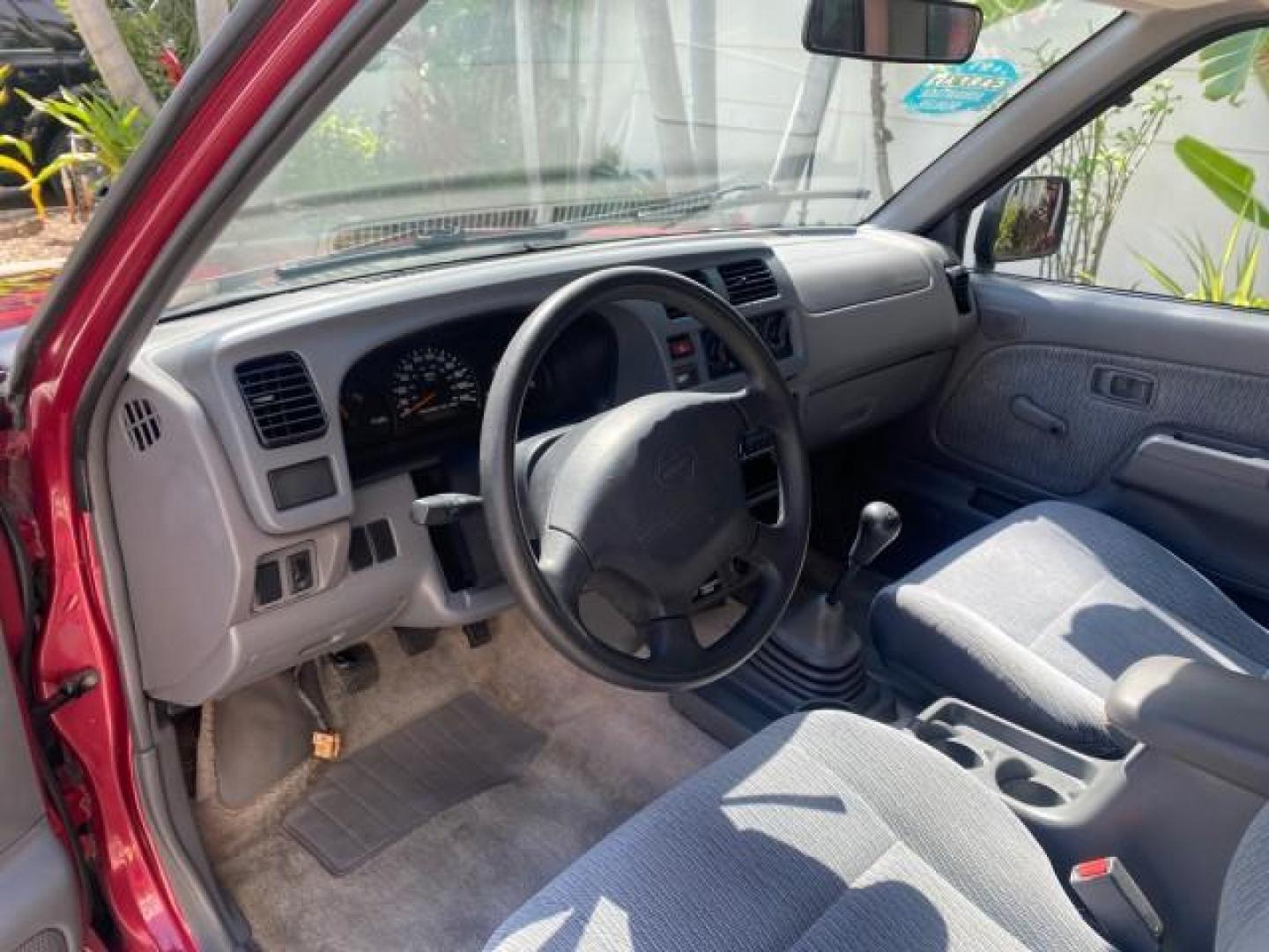 1998 Cheyenne Red (Met) /Gray Nissan Frontier 2WD XE XCAB 5 SPD LOW MILES 69,333 (1N6DD26S8WC) with an 2.4L DOHC SFI 16-Valve 4-Cyl Engine engine, Manual transmission, located at 4701 North Dixie Hwy, Pompano Beach, FL, 33064, (954) 422-2889, 26.240938, -80.123474 - OUR WEBPAGE FLORIDACARS1.COM HAS OVER 100 PHOTOS AND FREE CARFAX LINK 1998 NISSAN FRONTIER XE VIN: 1N6DD26S8WC390232 1 N 6 D D 2 6 S 8 W C 3 9 0 2 3 2 CLUB CAB PICKUP 2.4L I4 F GASOLINE REAR WHEEL DRIVE Top Features Alloy Wheels Cloth Seats Basic Features ABS Brakes AM/FM Stereo Air Conditioning Man - Photo#33