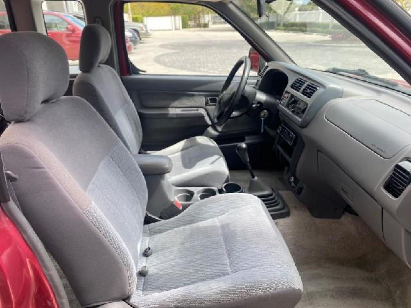 1998 Cheyenne Red (Met) /Gray Nissan Frontier 2WD XE XCAB 5 SPD LOW MILES 69,333 (1N6DD26S8WC) with an 2.4L DOHC SFI 16-Valve 4-Cyl Engine engine, Manual transmission, located at 4701 North Dixie Hwy, Pompano Beach, FL, 33064, (954) 422-2889, 26.240938, -80.123474 - OUR WEBPAGE FLORIDACARS1.COM HAS OVER 100 PHOTOS AND FREE CARFAX LINK 1998 NISSAN FRONTIER XE VIN: 1N6DD26S8WC390232 1 N 6 D D 2 6 S 8 W C 3 9 0 2 3 2 CLUB CAB PICKUP 2.4L I4 F GASOLINE REAR WHEEL DRIVE Top Features Alloy Wheels Cloth Seats Basic Features ABS Brakes AM/FM Stereo Air Conditioning Man - Photo#90