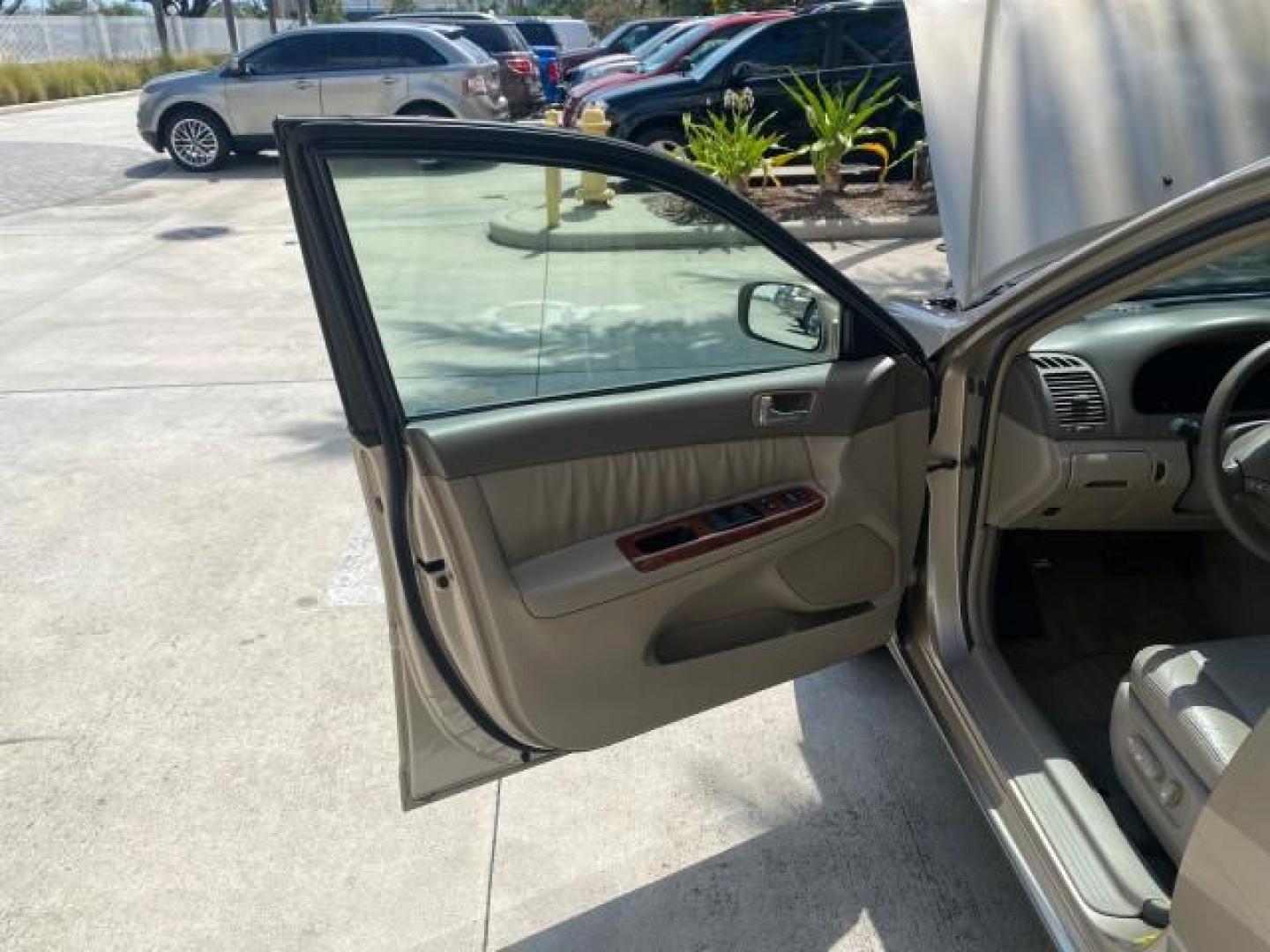 2005 Desert Sand Mica /Taupe Toyota Camry XLE V6 SUNROOF LEATHER (4T1BF30K35U) with an 3.0L DOHC MPFI Vvti 24-Valve V6 Engine engine, Automatic transmission, located at 4701 North Dixie Hwy, Pompano Beach, FL, 33064, (954) 422-2889, 26.240938, -80.123474 - OUR WEBPAGE FLORIDACARS1.COM HAS OVER 100 PHOTOS AND FREE CARFAX LINK 2005 TOYOTA CAMRY LE V6 SUNROOF LEATHER BUCKET SEATS VIN: 4T1BF30K35U597683 4 T 1 B F 3 0 K 3 5 U 5 9 7 6 8 3 SEDAN 4 DR 3.0L V6 F DOHC 24V GASOLINE 28 MPG FRONT WHEEL DRIVE TIRES ARE NEW ! Top Features Alloy Wheels Luxury Package - Photo#9