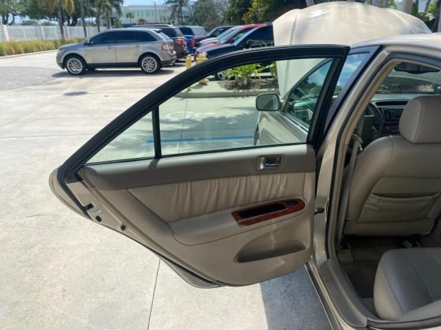 2005 Desert Sand Mica /Taupe Toyota Camry XLE V6 SUNROOF LEATHER (4T1BF30K35U) with an 3.0L DOHC MPFI Vvti 24-Valve V6 Engine engine, Automatic transmission, located at 4701 North Dixie Hwy, Pompano Beach, FL, 33064, (954) 422-2889, 26.240938, -80.123474 - OUR WEBPAGE FLORIDACARS1.COM HAS OVER 100 PHOTOS AND FREE CARFAX LINK 2005 TOYOTA CAMRY LE V6 SUNROOF LEATHER BUCKET SEATS VIN: 4T1BF30K35U597683 4 T 1 B F 3 0 K 3 5 U 5 9 7 6 8 3 SEDAN 4 DR 3.0L V6 F DOHC 24V GASOLINE 28 MPG FRONT WHEEL DRIVE TIRES ARE NEW ! Top Features Alloy Wheels Luxury Package - Photo#13