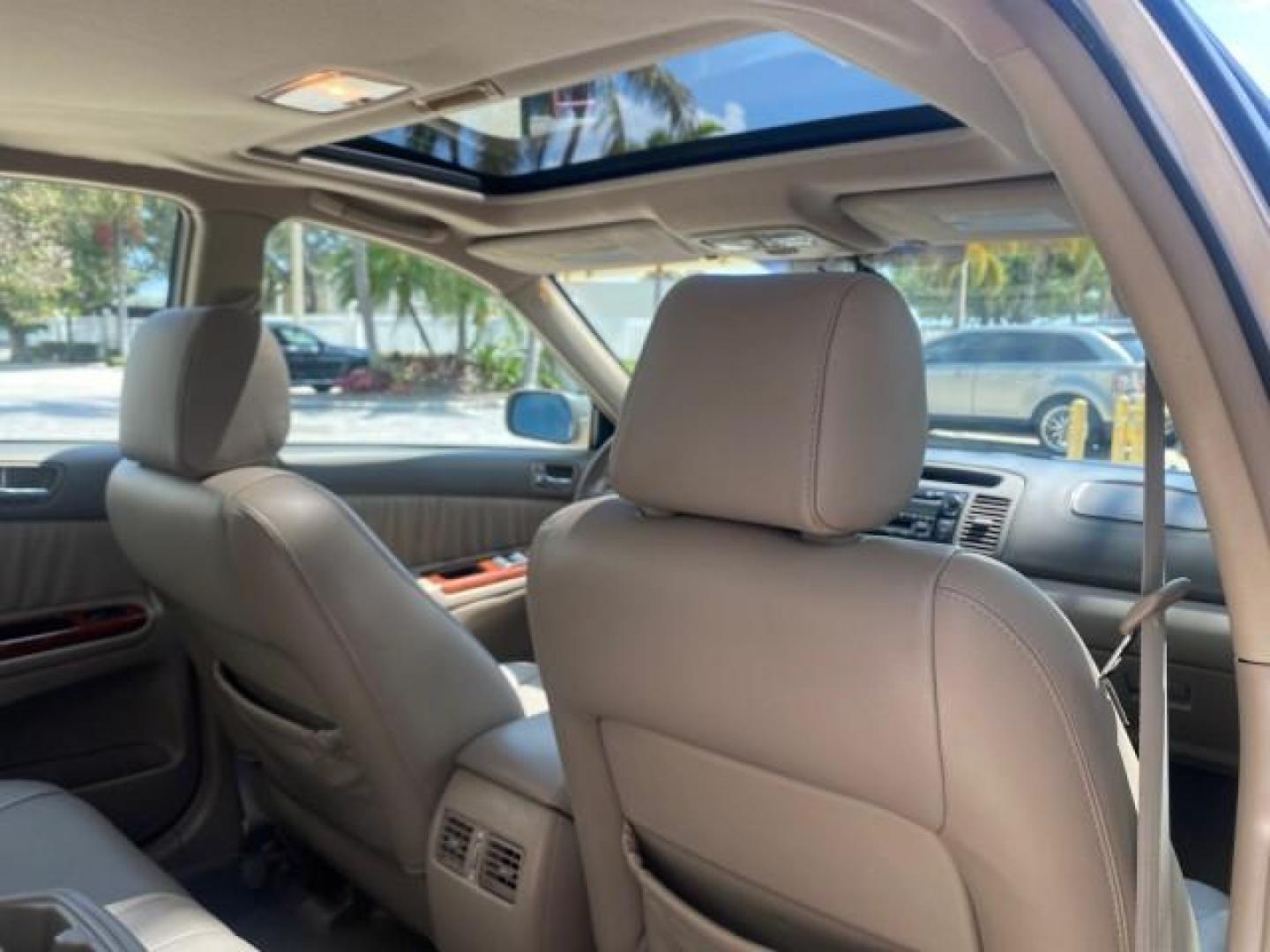 2005 Desert Sand Mica /Taupe Toyota Camry XLE V6 SUNROOF LEATHER (4T1BF30K35U) with an 3.0L DOHC MPFI Vvti 24-Valve V6 Engine engine, Automatic transmission, located at 4701 North Dixie Hwy, Pompano Beach, FL, 33064, (954) 422-2889, 26.240938, -80.123474 - OUR WEBPAGE FLORIDACARS1.COM HAS OVER 100 PHOTOS AND FREE CARFAX LINK 2005 TOYOTA CAMRY LE V6 SUNROOF LEATHER BUCKET SEATS VIN: 4T1BF30K35U597683 4 T 1 B F 3 0 K 3 5 U 5 9 7 6 8 3 SEDAN 4 DR 3.0L V6 F DOHC 24V GASOLINE 28 MPG FRONT WHEEL DRIVE TIRES ARE NEW ! Top Features Alloy Wheels Luxury Package - Photo#85