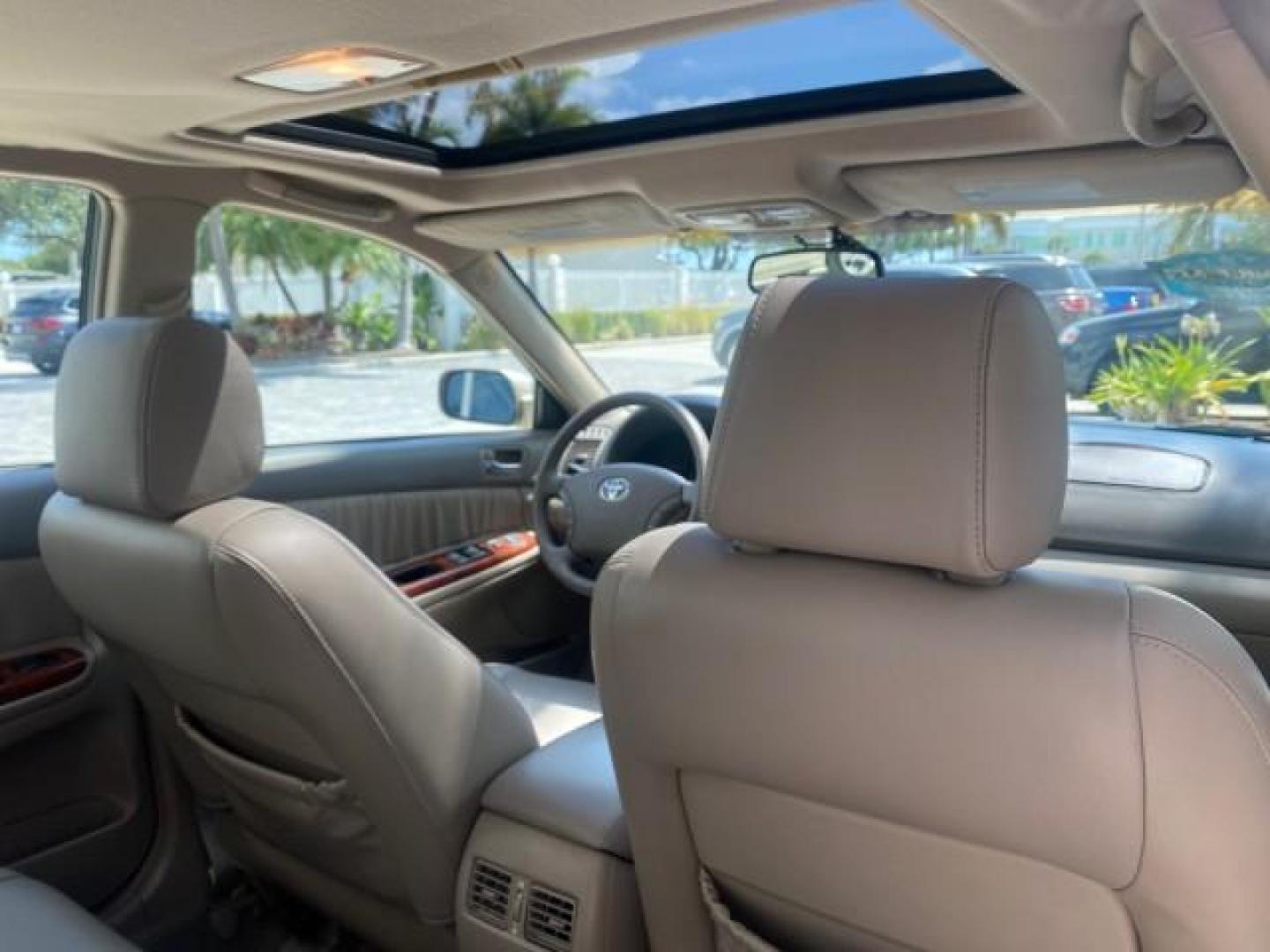 2005 Desert Sand Mica /Taupe Toyota Camry XLE V6 SUNROOF LEATHER (4T1BF30K35U) with an 3.0L DOHC MPFI Vvti 24-Valve V6 Engine engine, Automatic transmission, located at 4701 North Dixie Hwy, Pompano Beach, FL, 33064, (954) 422-2889, 26.240938, -80.123474 - OUR WEBPAGE FLORIDACARS1.COM HAS OVER 100 PHOTOS AND FREE CARFAX LINK 2005 TOYOTA CAMRY LE V6 SUNROOF LEATHER BUCKET SEATS VIN: 4T1BF30K35U597683 4 T 1 B F 3 0 K 3 5 U 5 9 7 6 8 3 SEDAN 4 DR 3.0L V6 F DOHC 24V GASOLINE 28 MPG FRONT WHEEL DRIVE TIRES ARE NEW ! Top Features Alloy Wheels Luxury Package - Photo#86