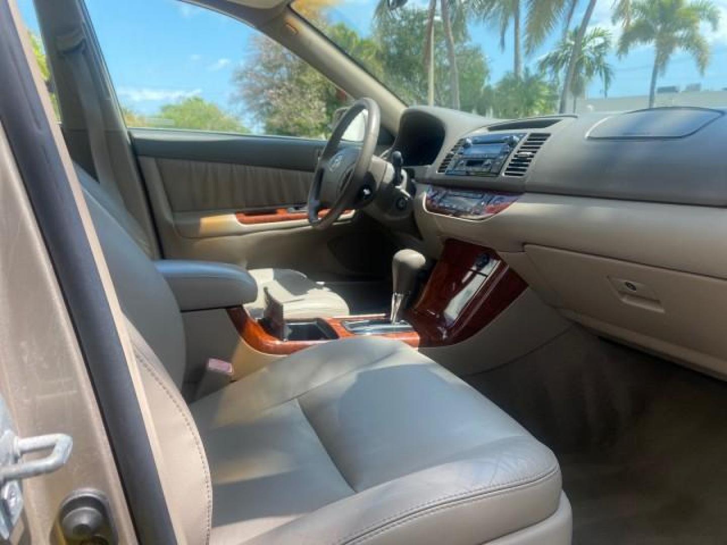 2005 Desert Sand Mica /Taupe Toyota Camry XLE V6 SUNROOF LEATHER (4T1BF30K35U) with an 3.0L DOHC MPFI Vvti 24-Valve V6 Engine engine, Automatic transmission, located at 4701 North Dixie Hwy, Pompano Beach, FL, 33064, (954) 422-2889, 26.240938, -80.123474 - OUR WEBPAGE FLORIDACARS1.COM HAS OVER 100 PHOTOS AND FREE CARFAX LINK 2005 TOYOTA CAMRY LE V6 SUNROOF LEATHER BUCKET SEATS VIN: 4T1BF30K35U597683 4 T 1 B F 3 0 K 3 5 U 5 9 7 6 8 3 SEDAN 4 DR 3.0L V6 F DOHC 24V GASOLINE 28 MPG FRONT WHEEL DRIVE TIRES ARE NEW ! Top Features Alloy Wheels Luxury Package - Photo#91